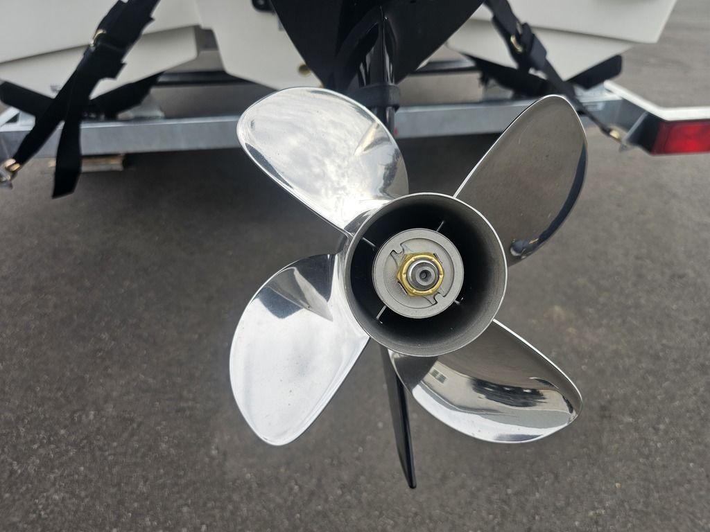2025 Mako Pro Skiff 15 CC boat propeller close-up on trailer.