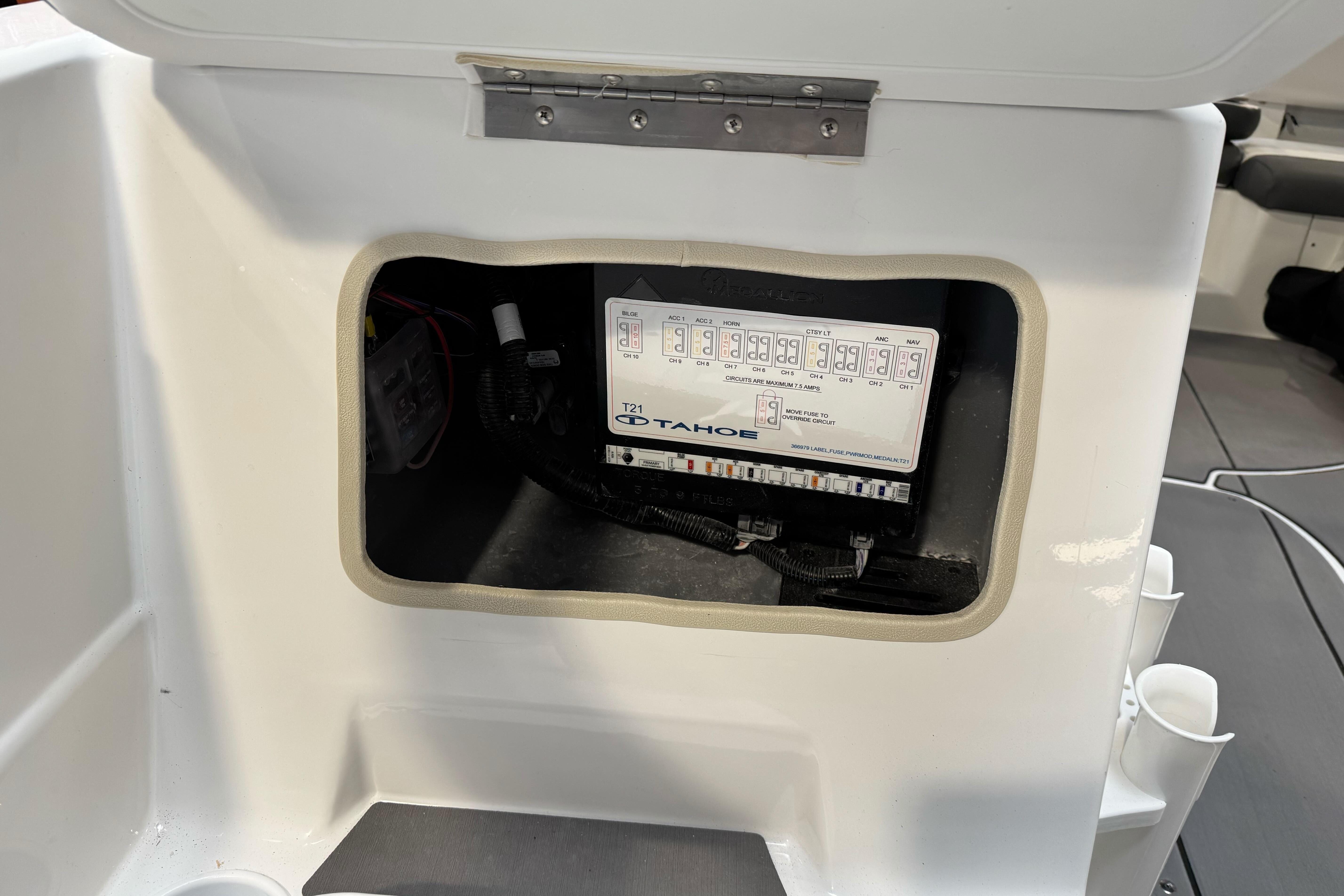 2026 Tahoe T21 boat electrical panel inside compartment.