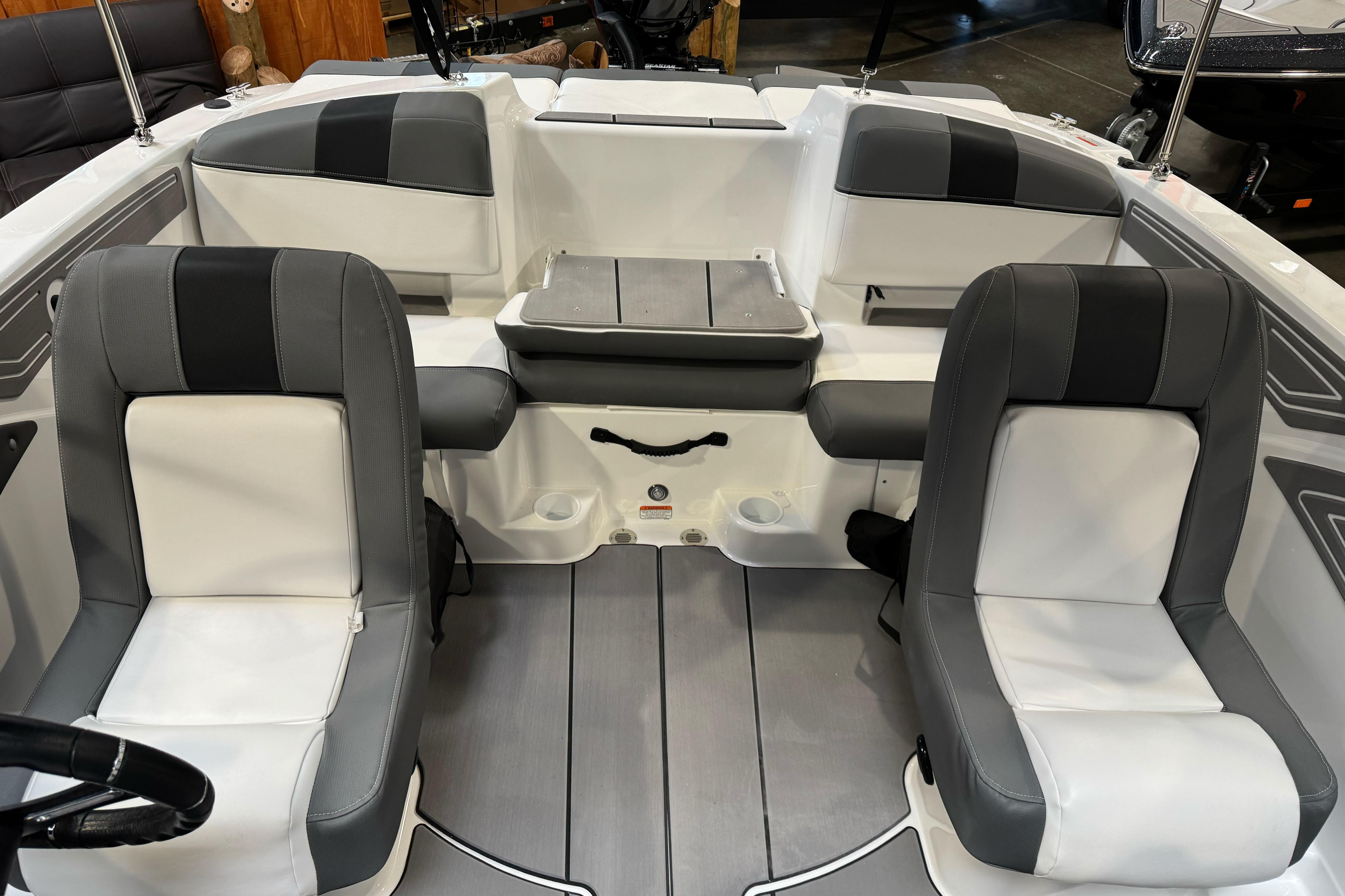 2026 Tahoe T21 boat interior with gray and white seating, modern design.