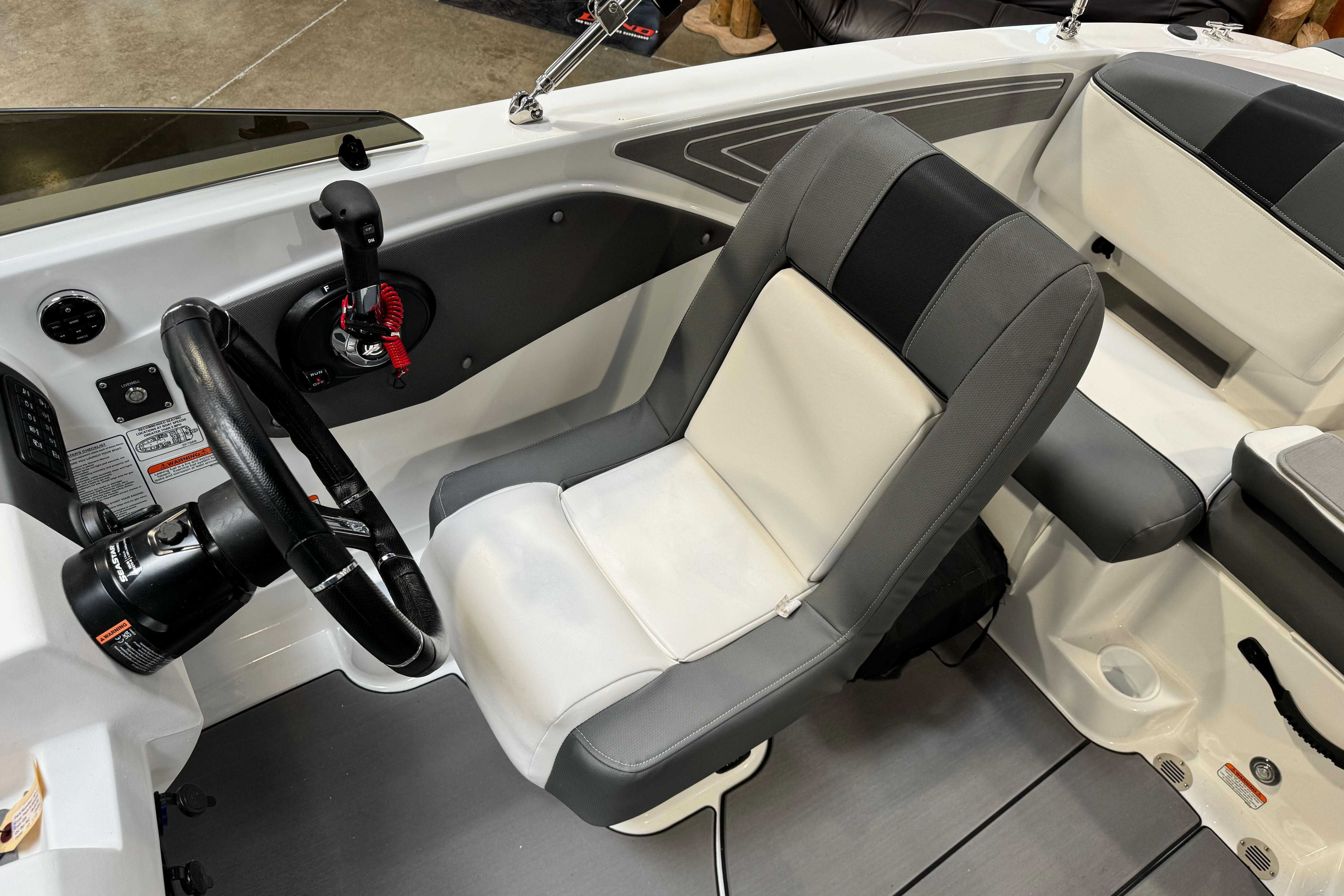 2026 Tahoe T21 boat interior with steering wheel and comfortable seating.