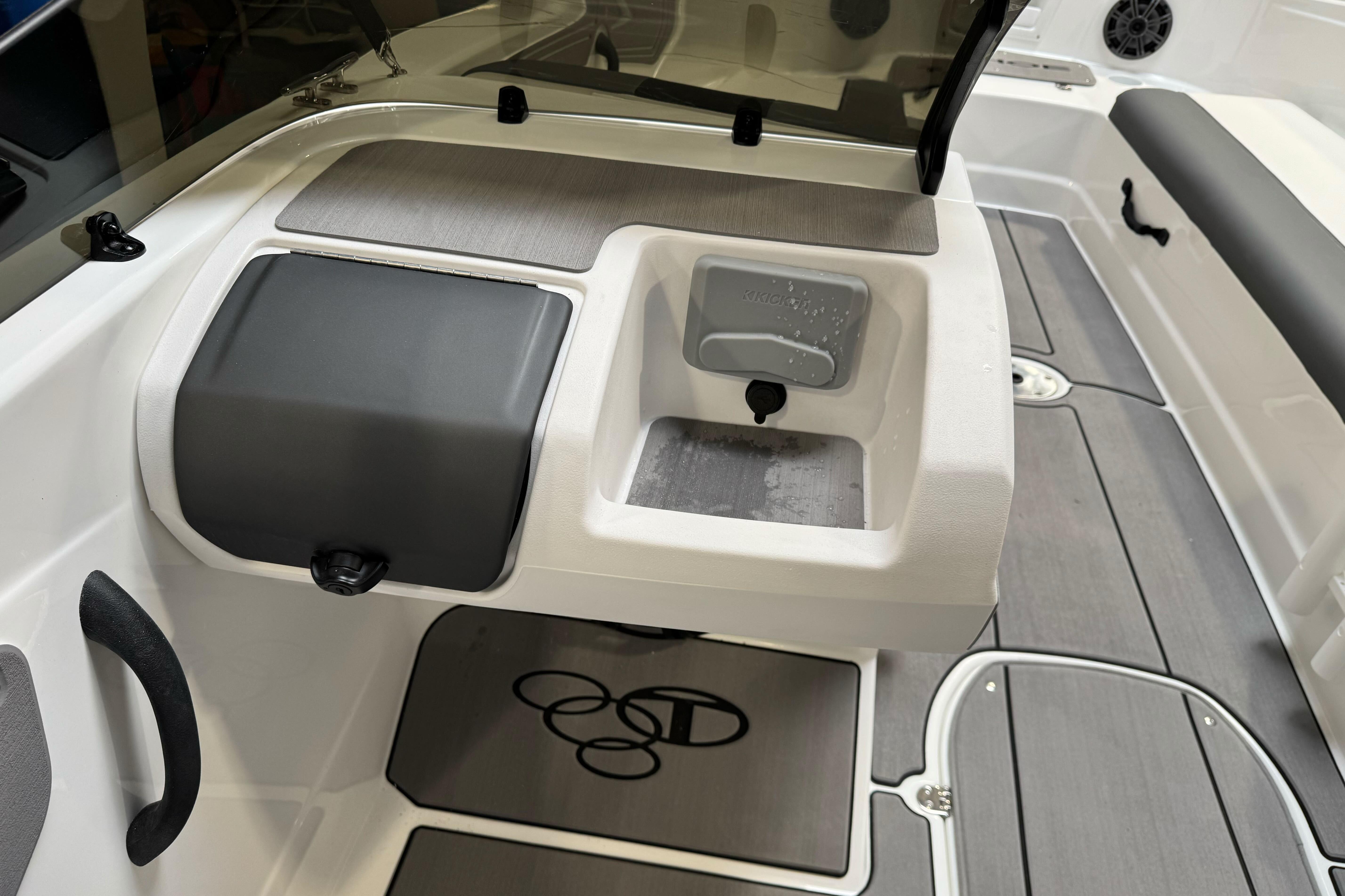 Interior of 2026 Tahoe T21 boat featuring storage and seating areas.