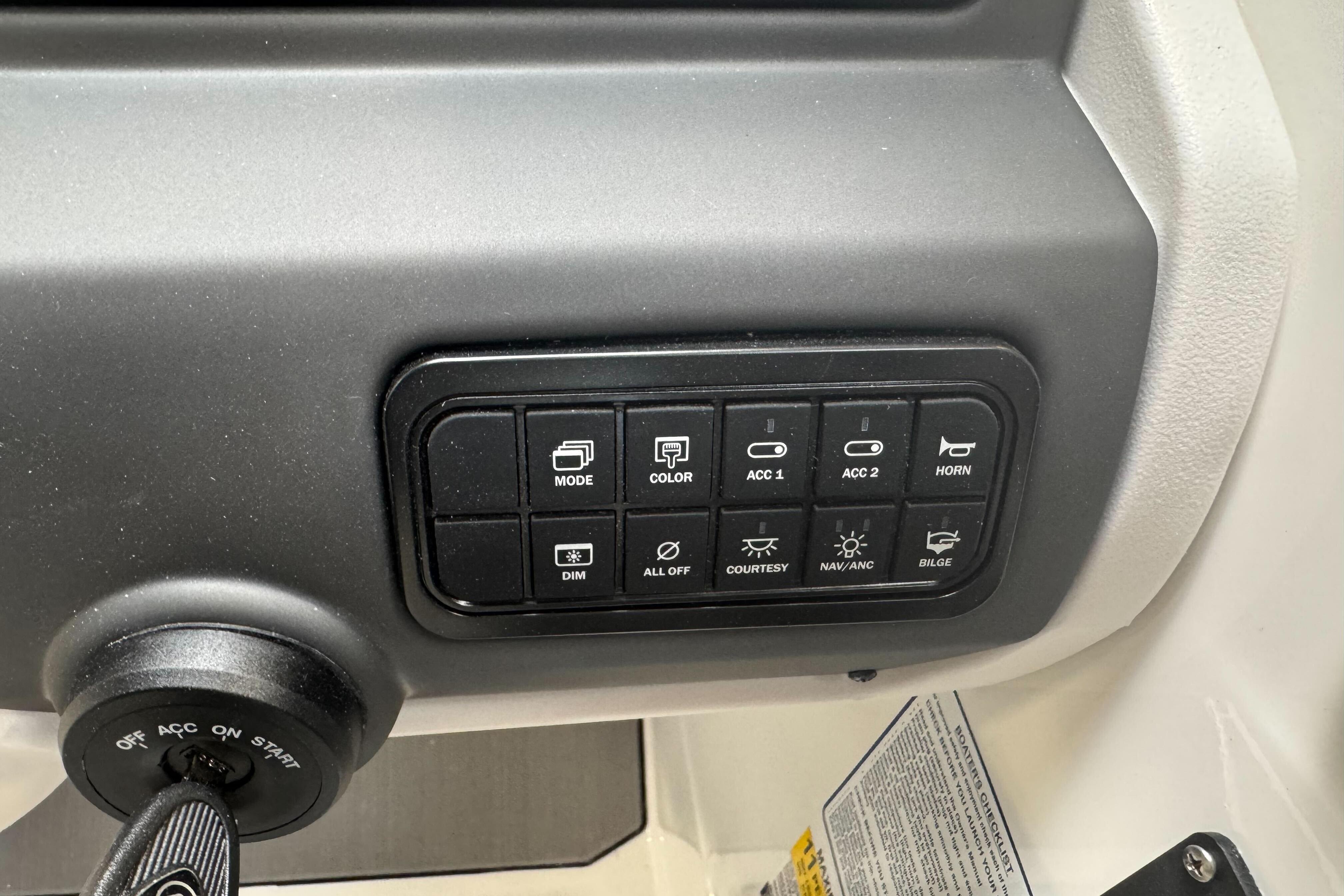 Control panel of 2026 Tahoe T21 boat with various function buttons.