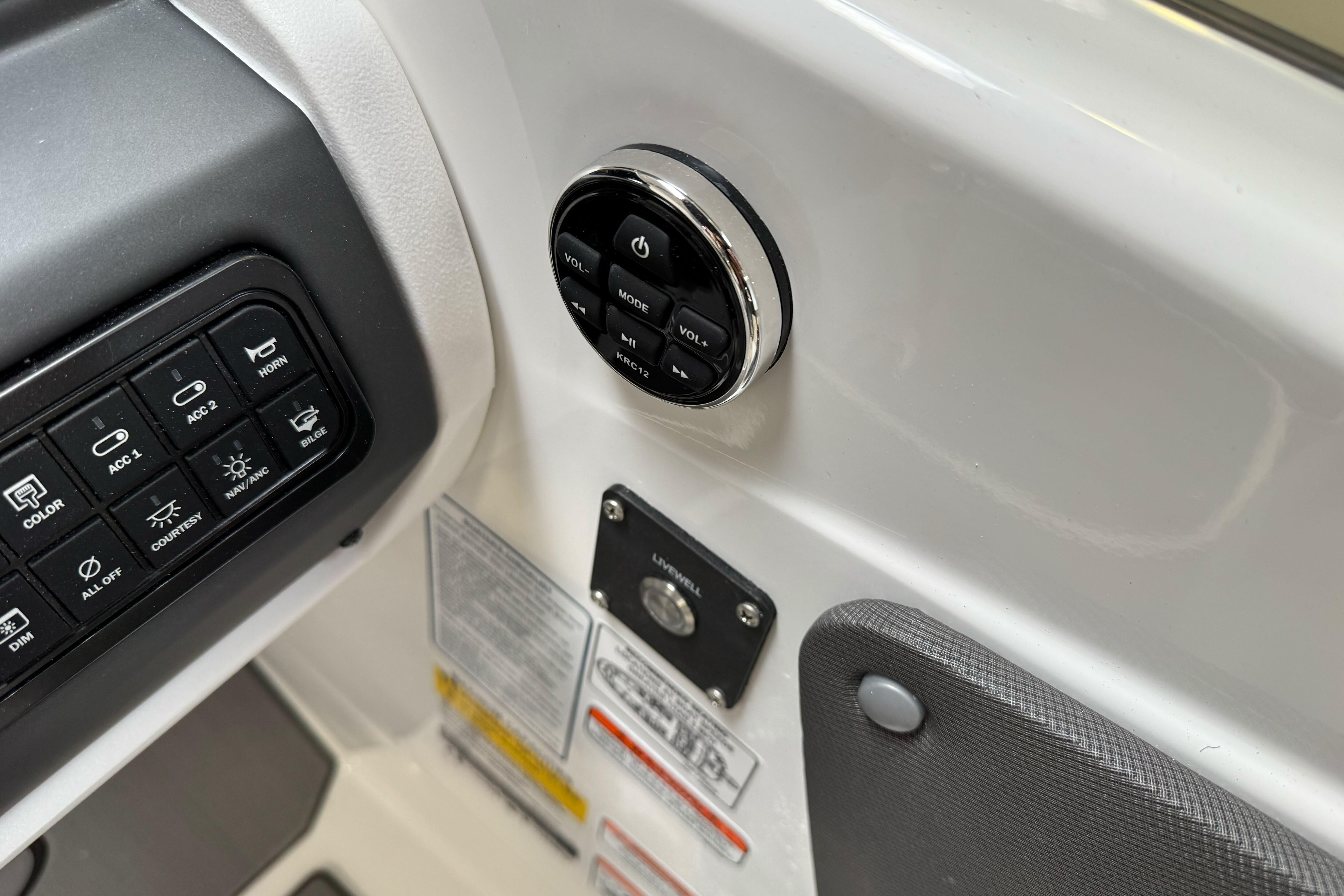 Control panel of 2026 Tahoe T21 boat with various switches and buttons.