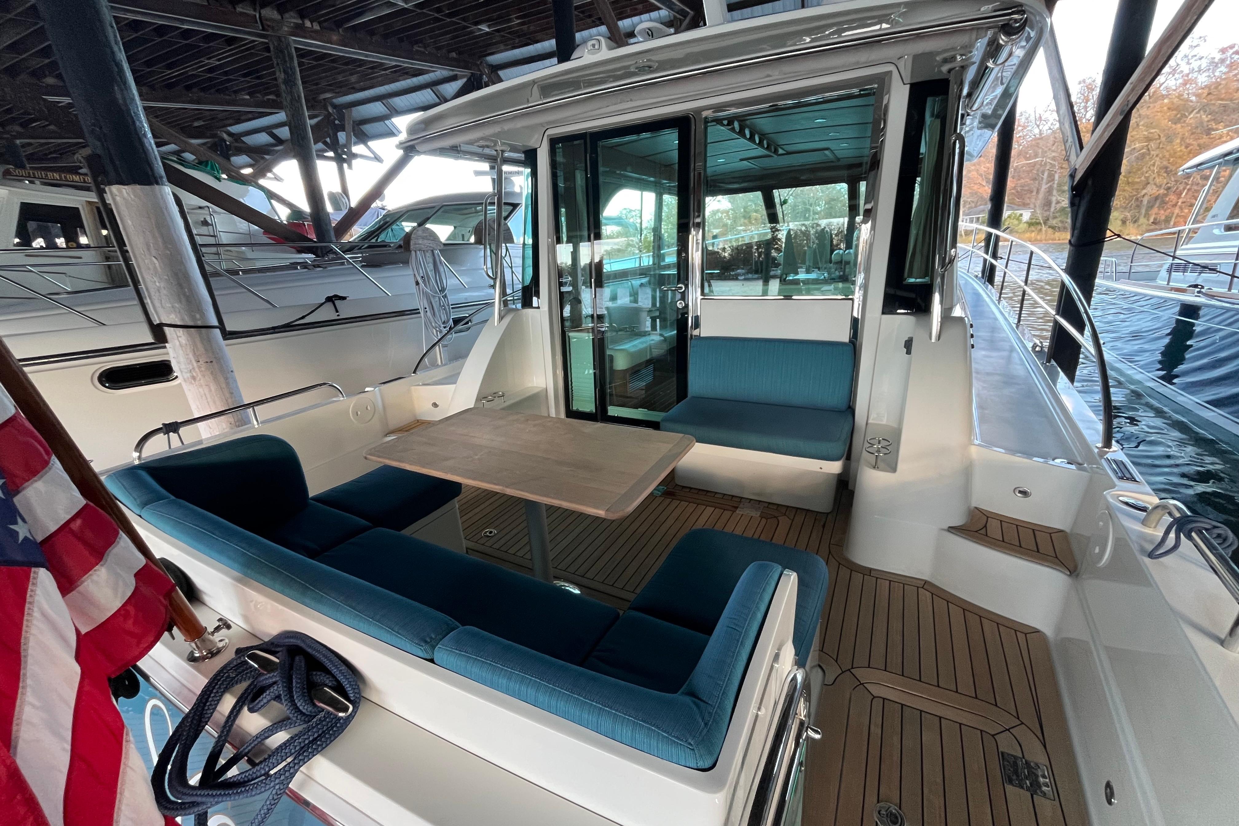 2019 Sabre 45 Salon Express yacht with outdoor seating and wooden deck.