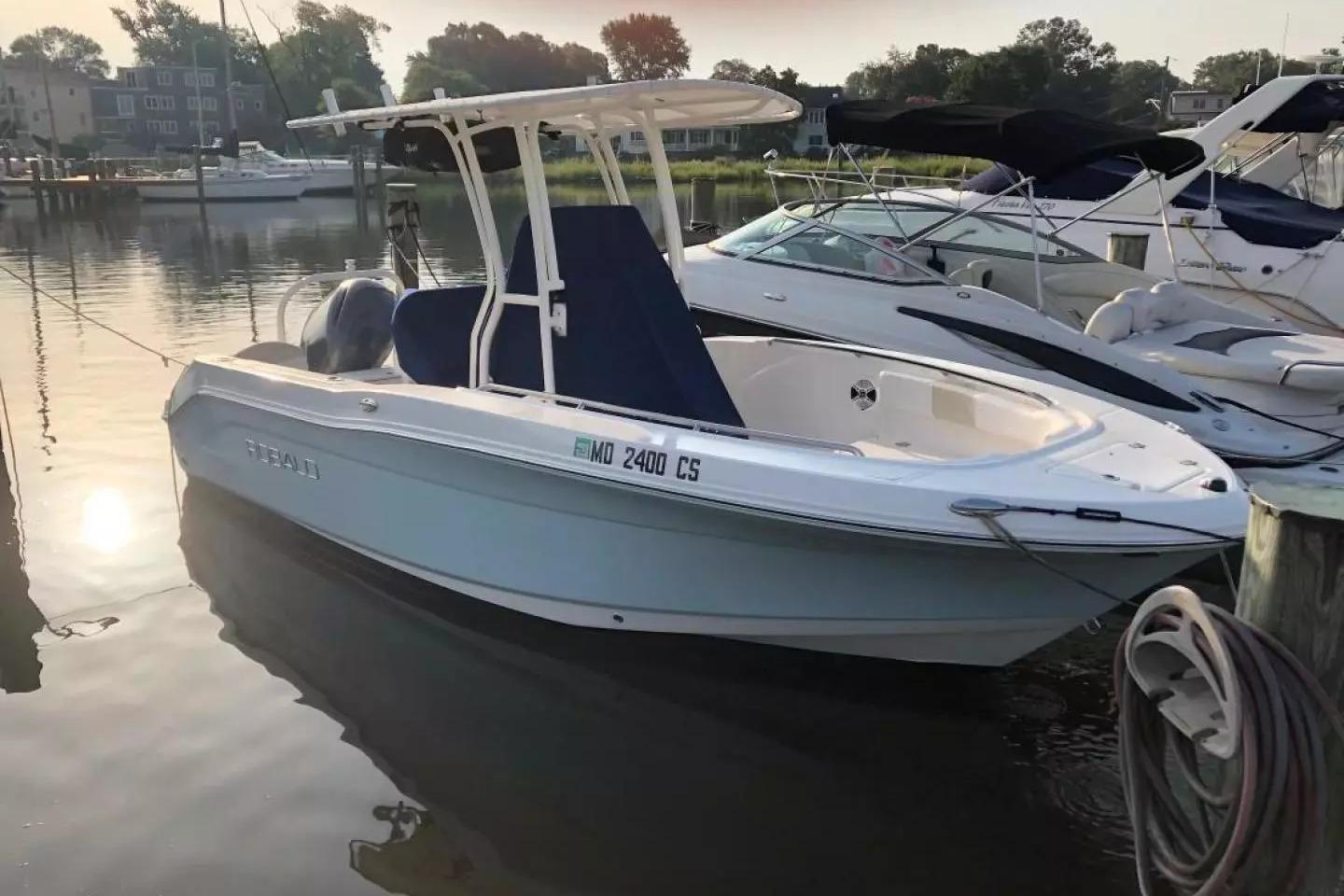 2016 Robalo R200 Center Console boat docked in a serene marina setting.