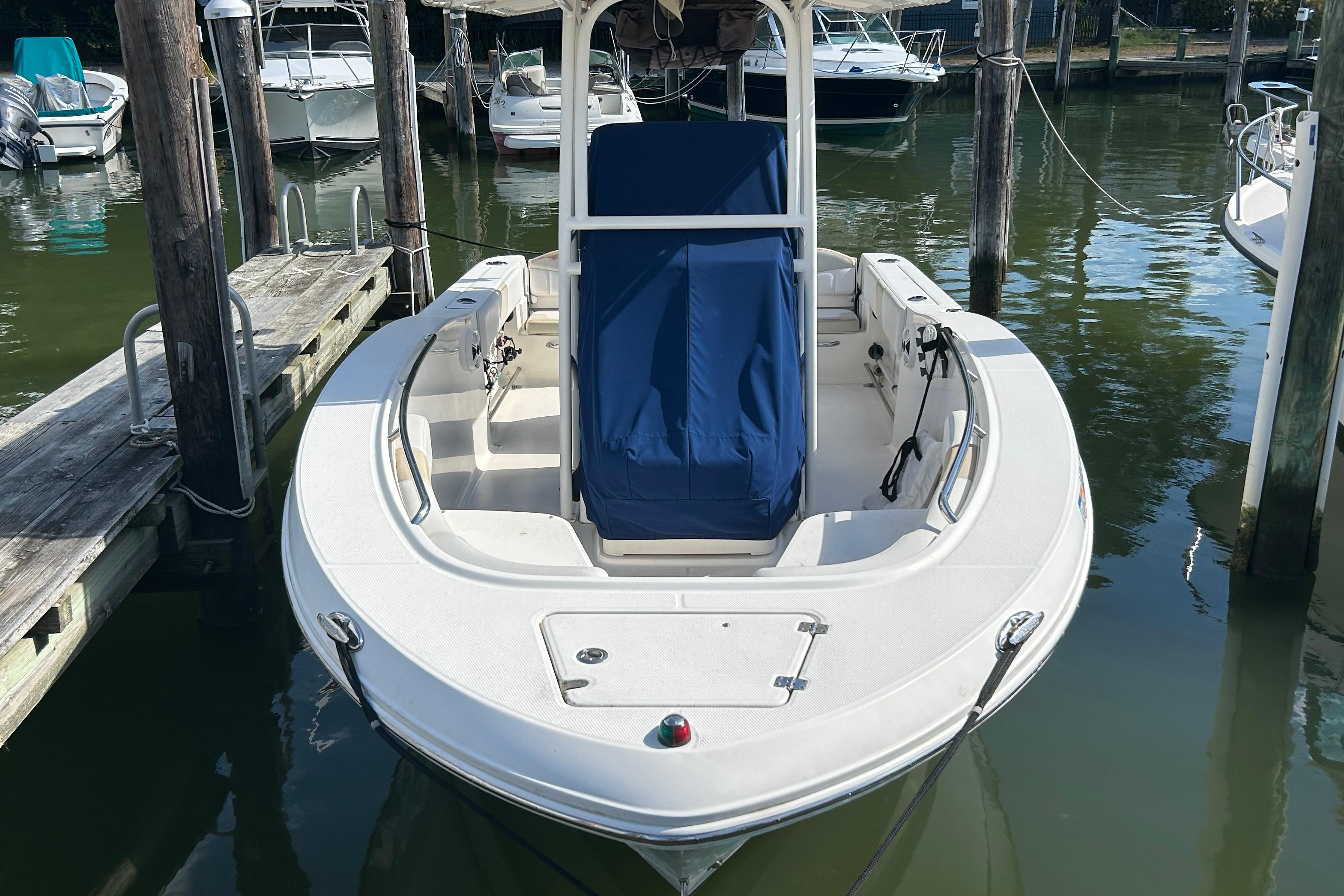 2016 Robalo R200 Center Console boat docked in marina.
