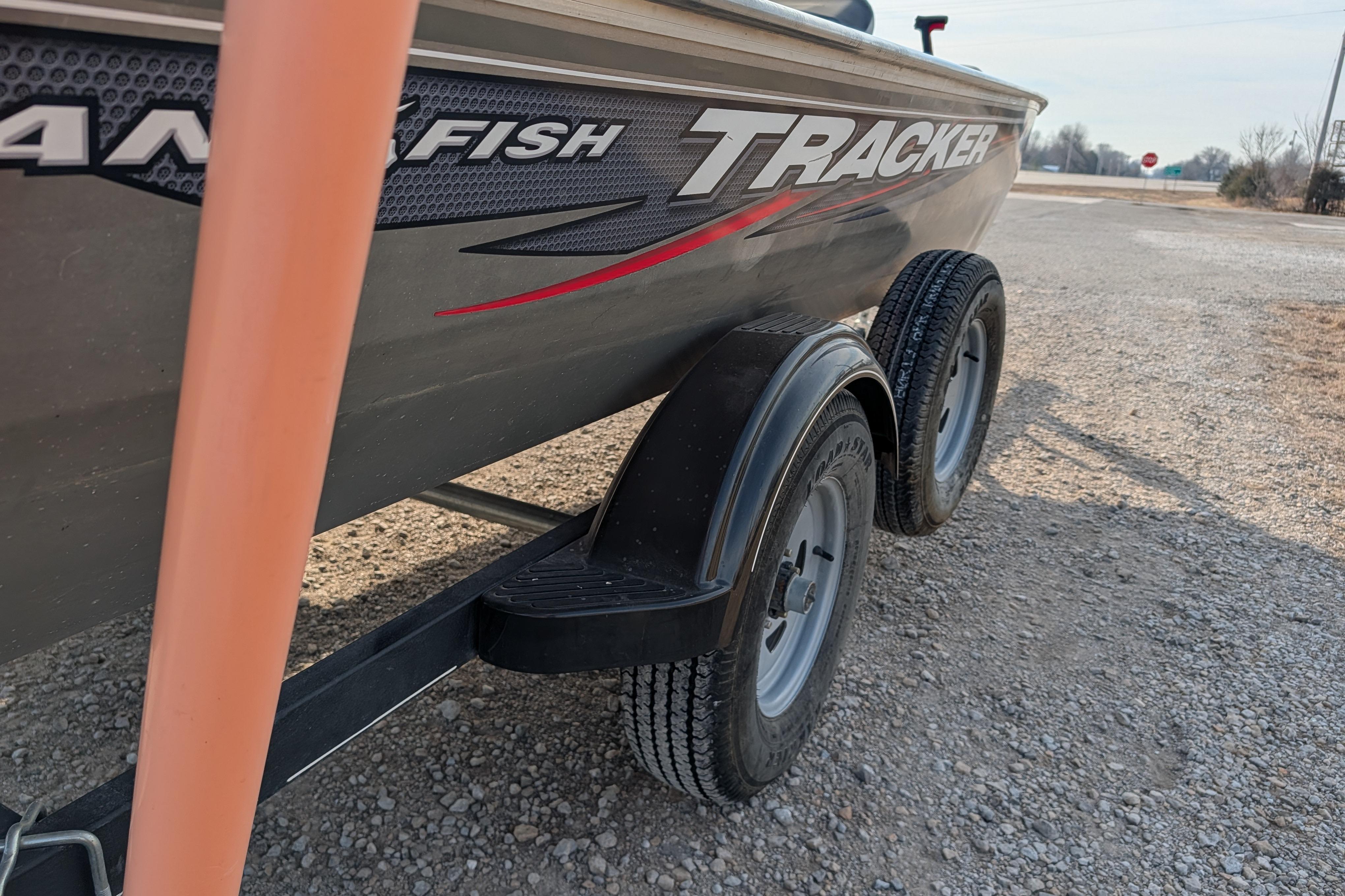 2017 Tracker Panfish 16 boat on trailer, gravel background.
