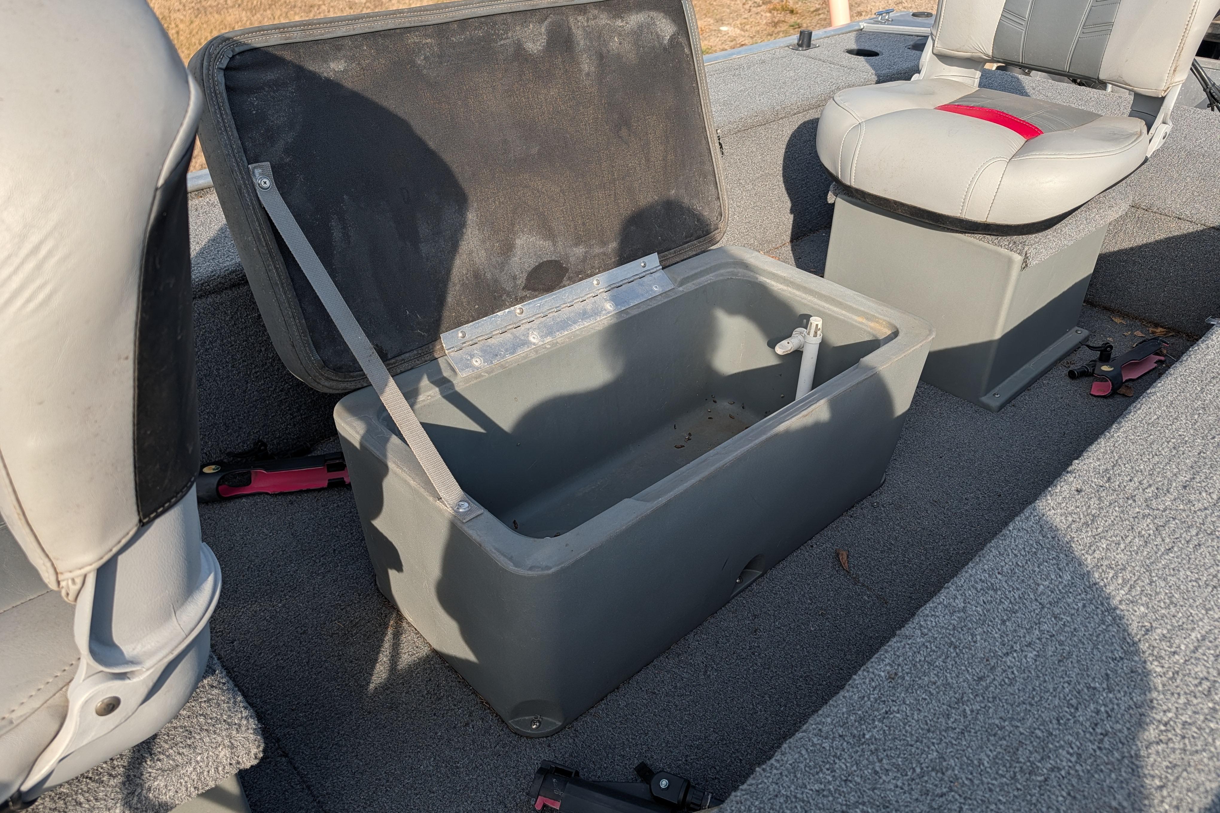 2017 Tracker Panfish 16 boat interior with open storage compartment and seating.