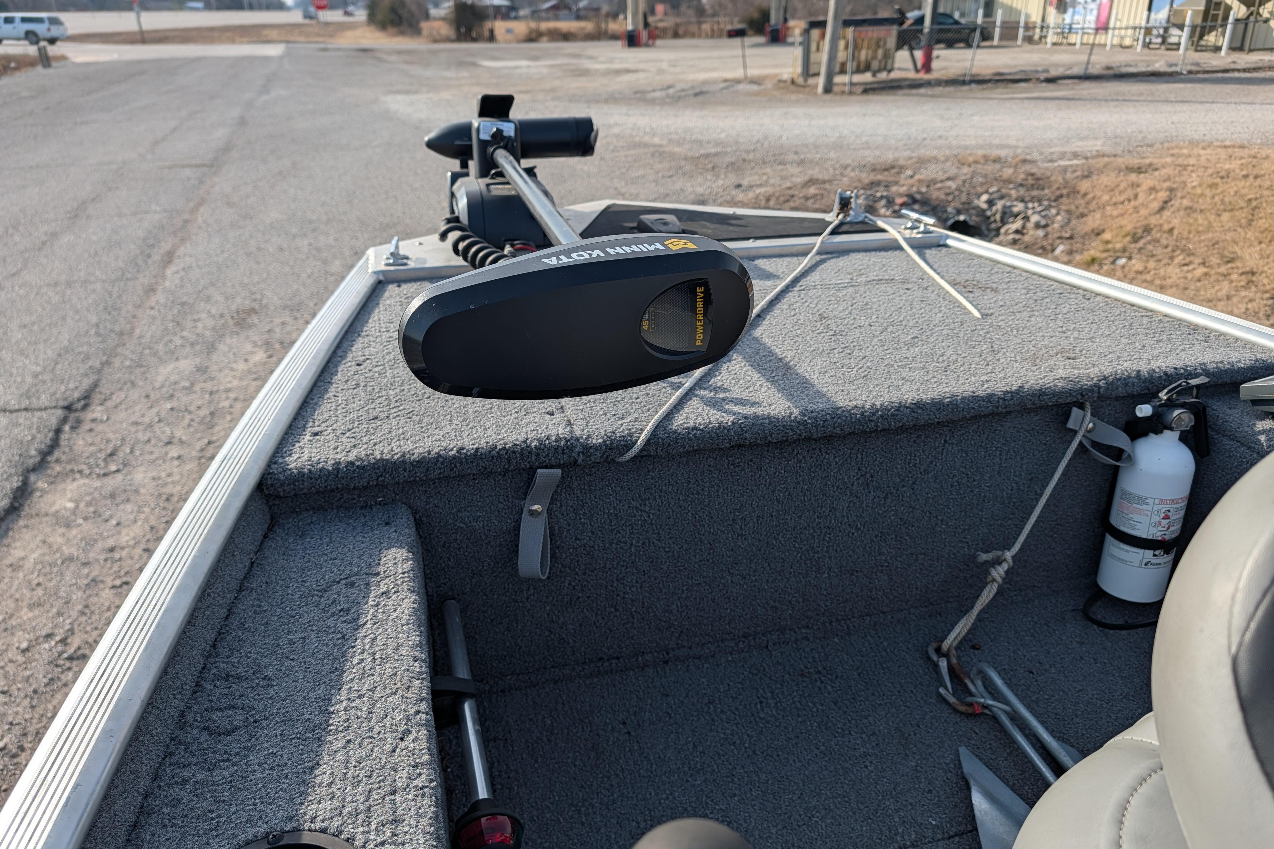 2017 Tracker Panfish 16 boat interior with trolling motor and fire extinguisher.
