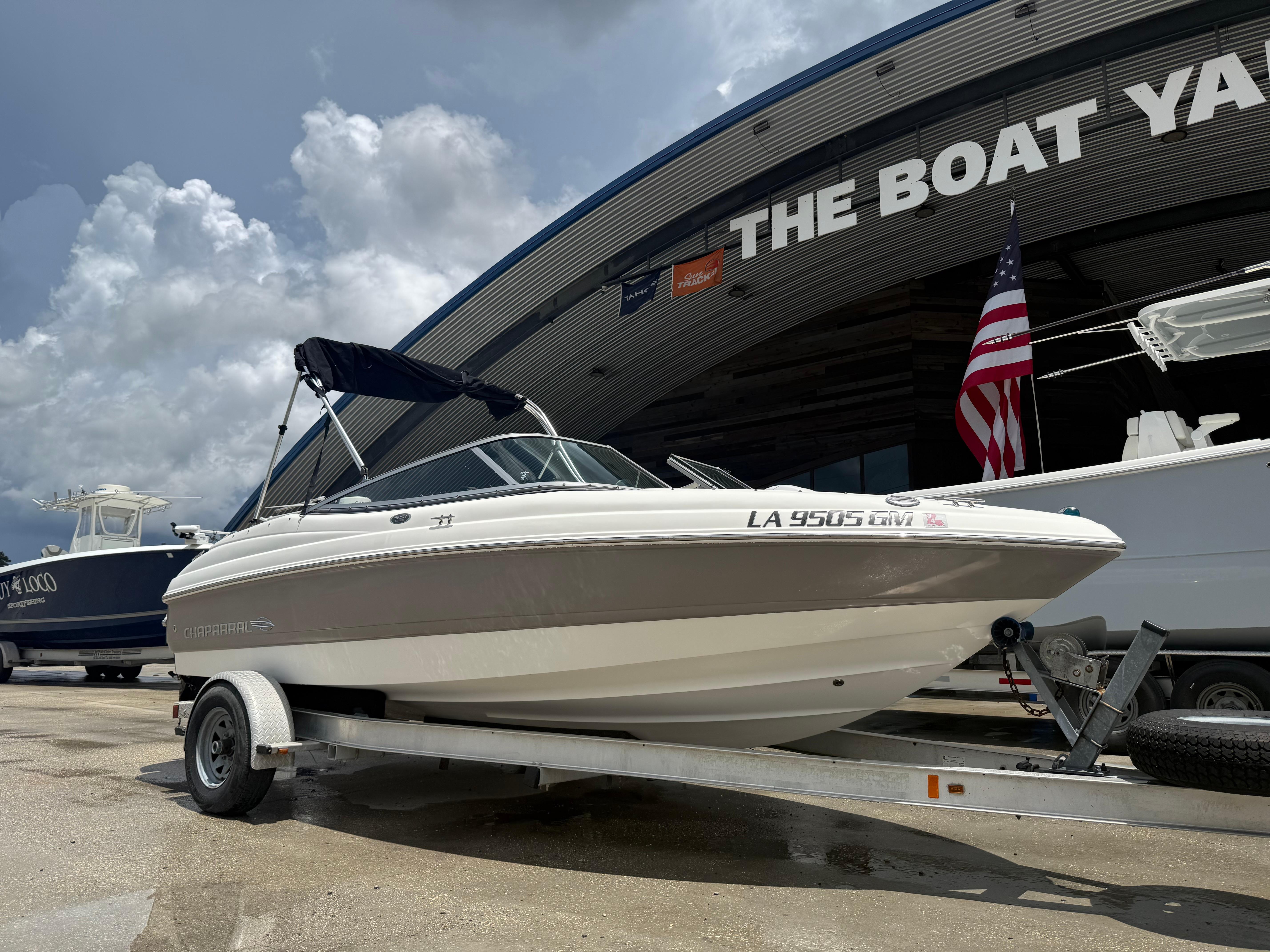2007 Chaparral 190 SSi boat on trailer at The Boat Yard, under cloudy sky.