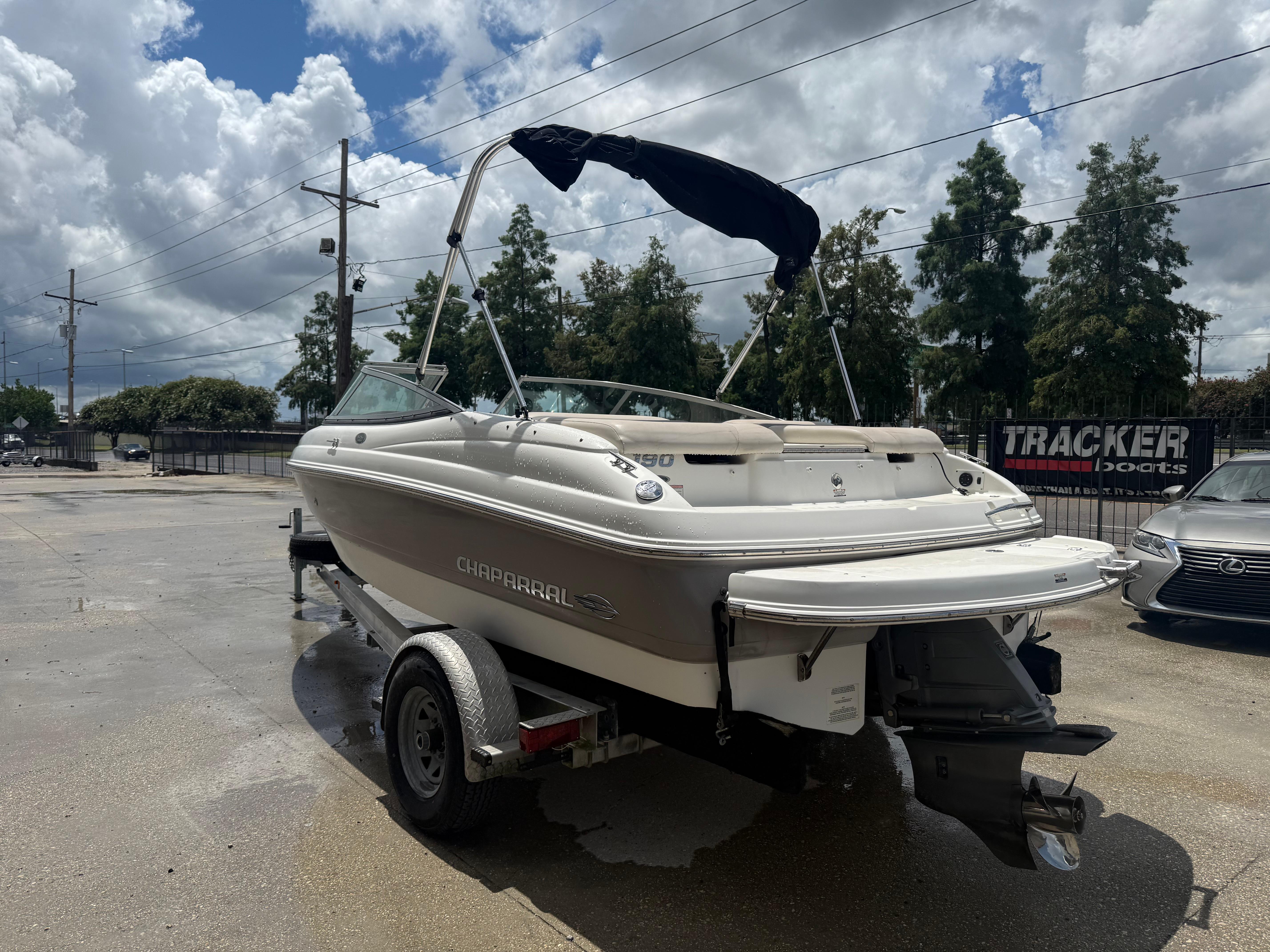 2007 Chaparral 190 SSi boat on trailer under cloudy sky.