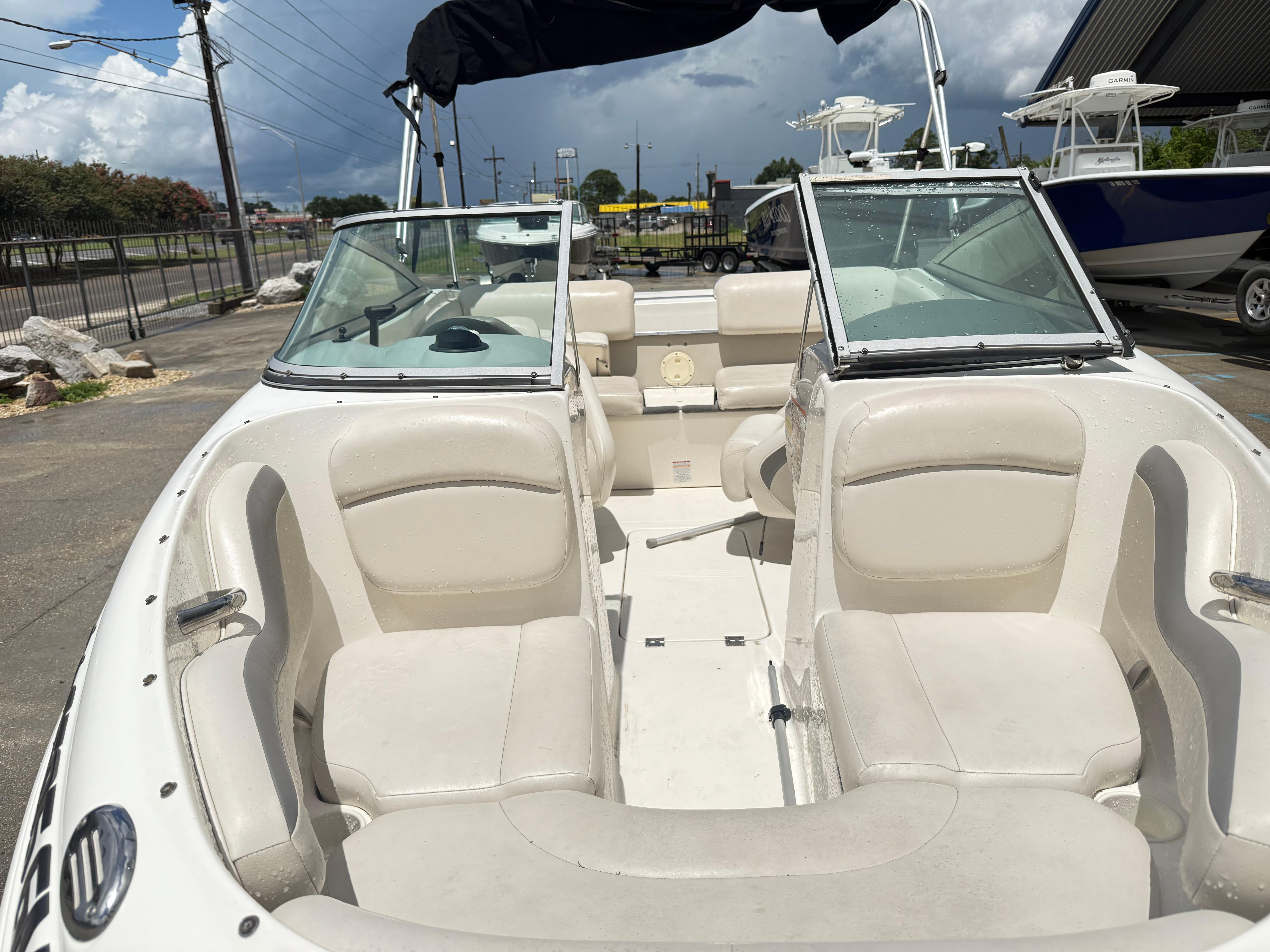 2007 Chaparral 190 SSi boat interior with white seating and open windshield.