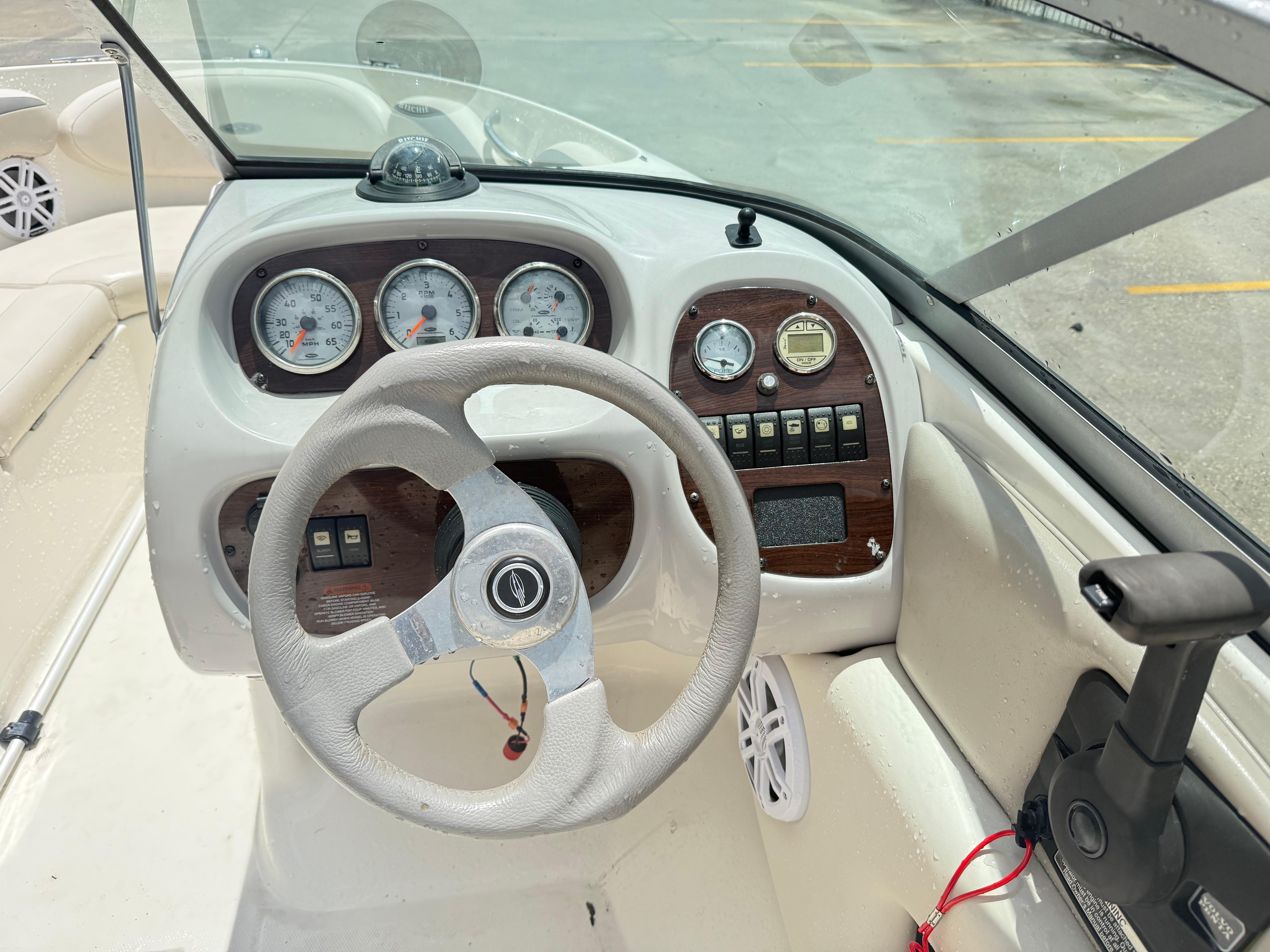 2007 Chaparral 190 SSi boat dashboard with steering wheel and instrument panel.
