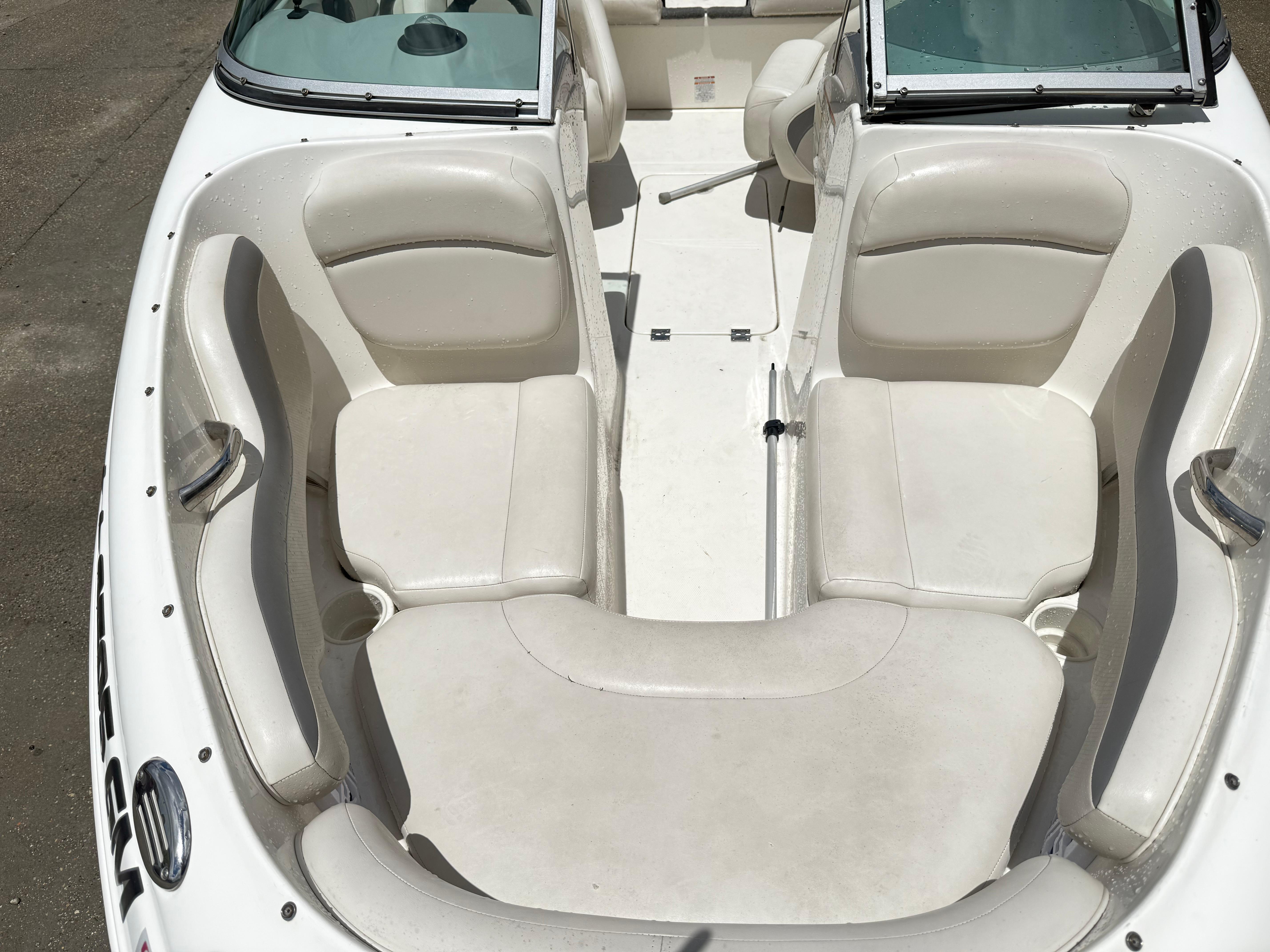 2007 Chaparral 190 SSi boat interior with white seating and open cockpit design.