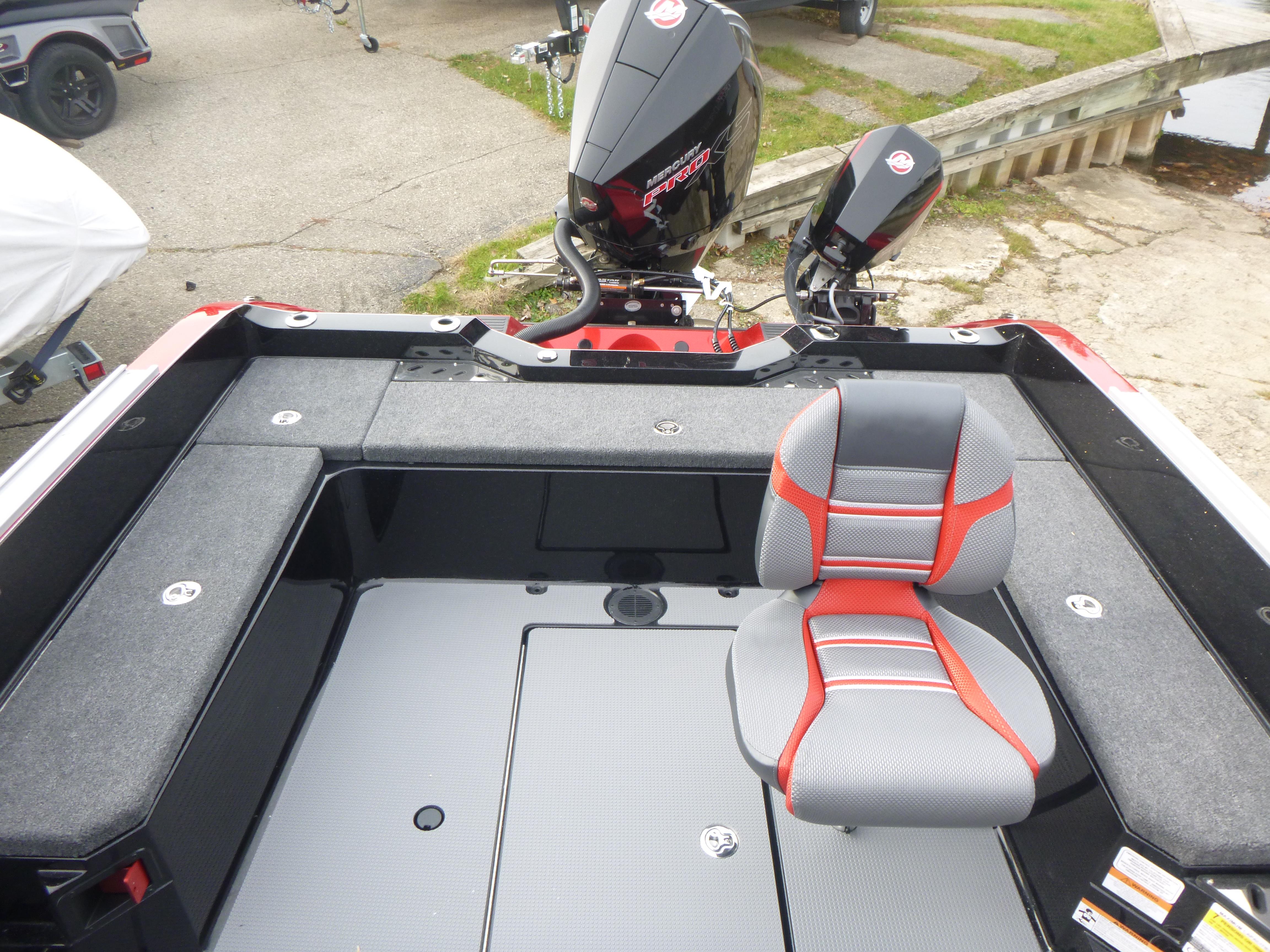 2025 Ranger 621FS Ranger Cup boat interior with seating and motor, docked outdoors.