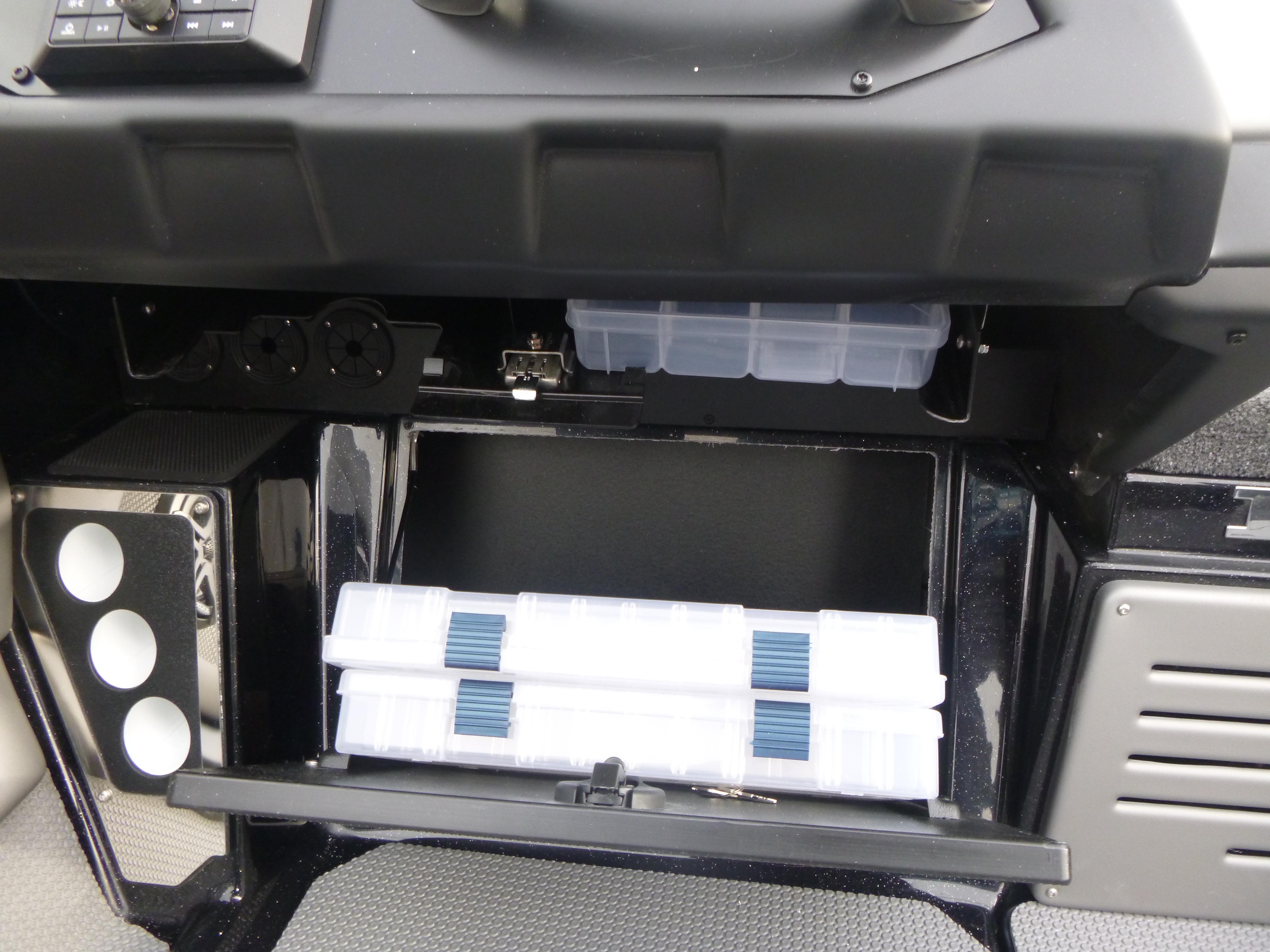 Storage compartment in 2025 Ranger 621FS Ranger Cup Equipped boat, featuring organized tackle boxes.