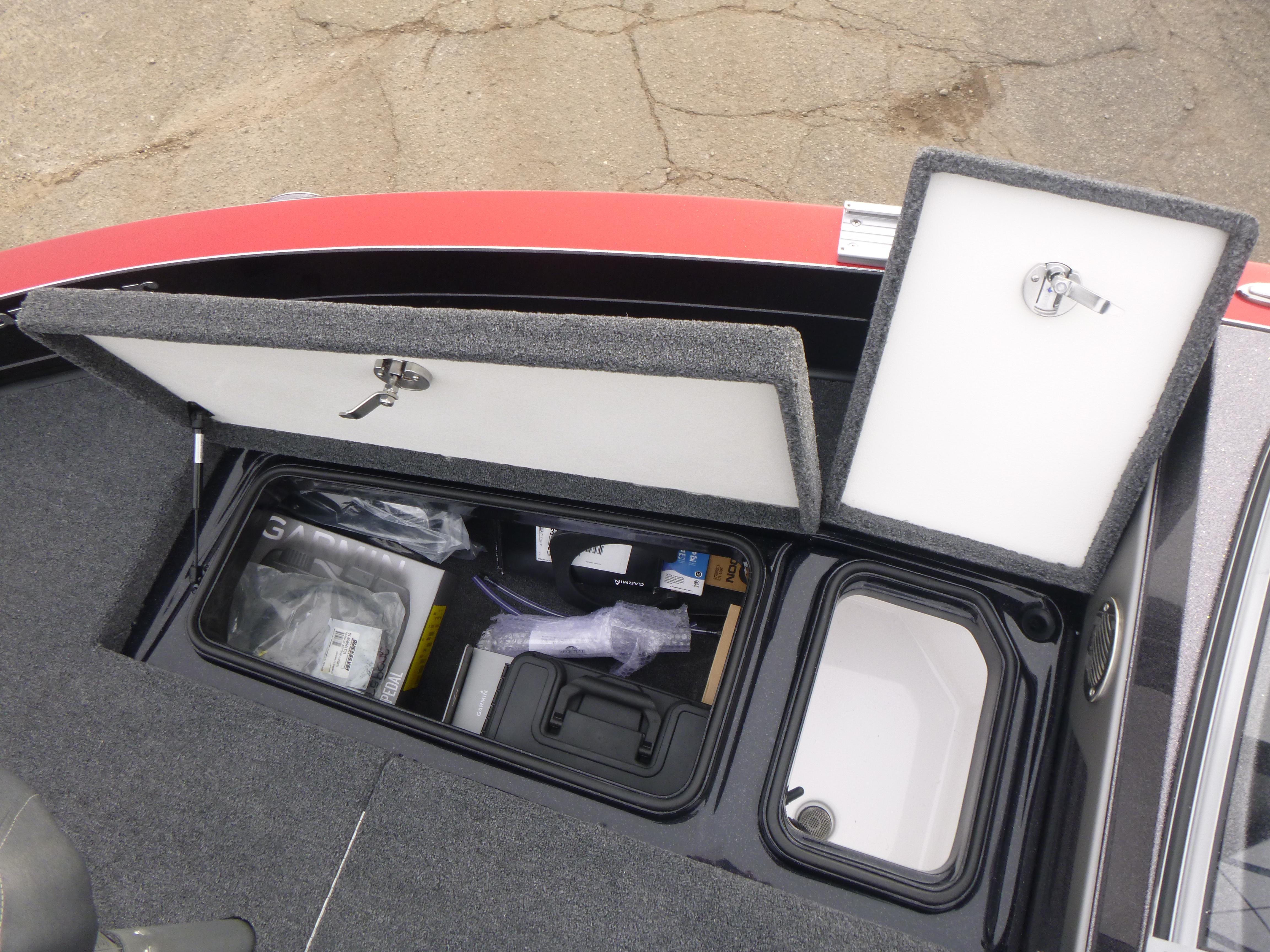 2025 Ranger 621FS Ranger Cup Equipped boat storage compartments open, showing organized interior.