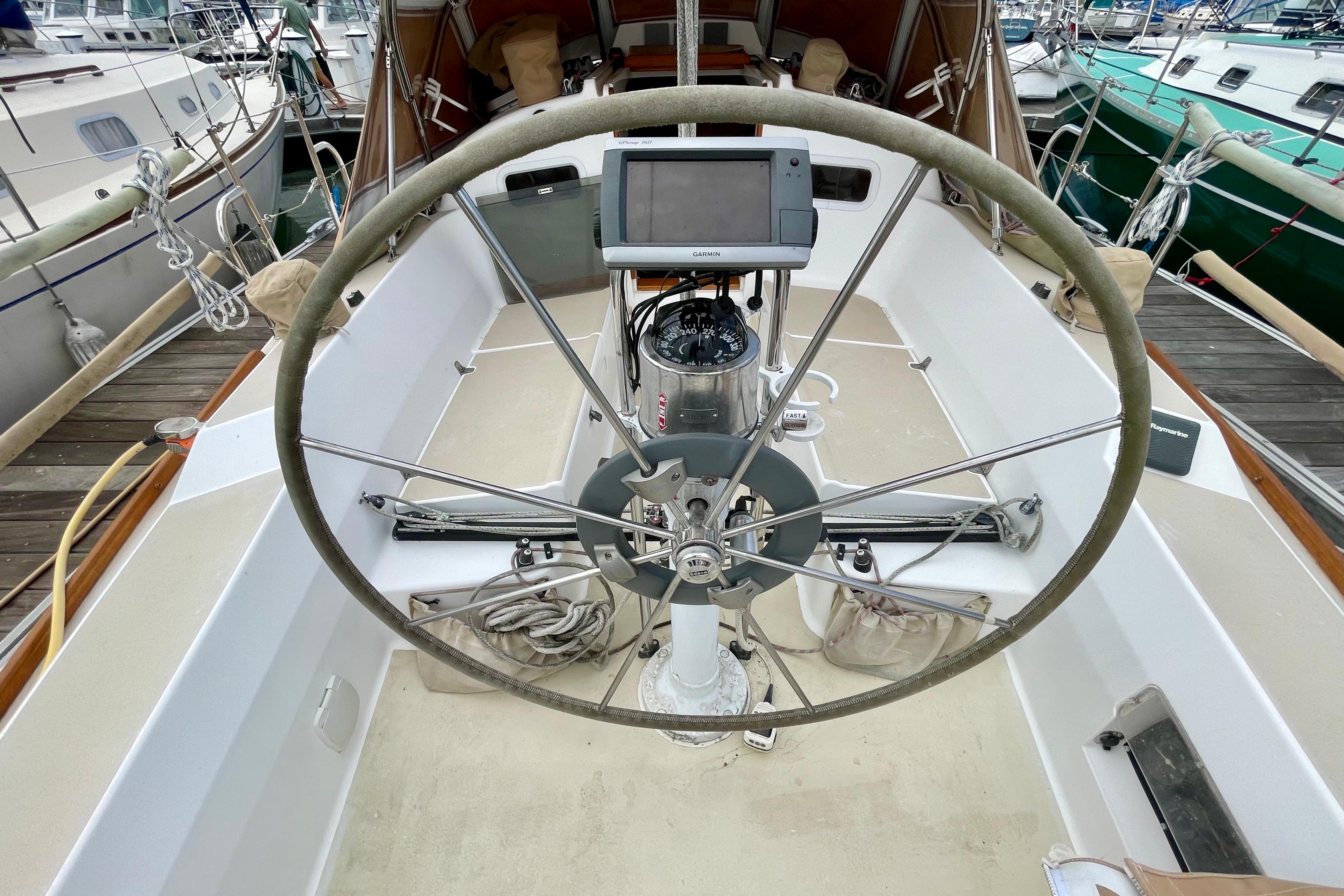 2001 J Boats J/32 sailboat cockpit with steering wheel and navigation equipment.