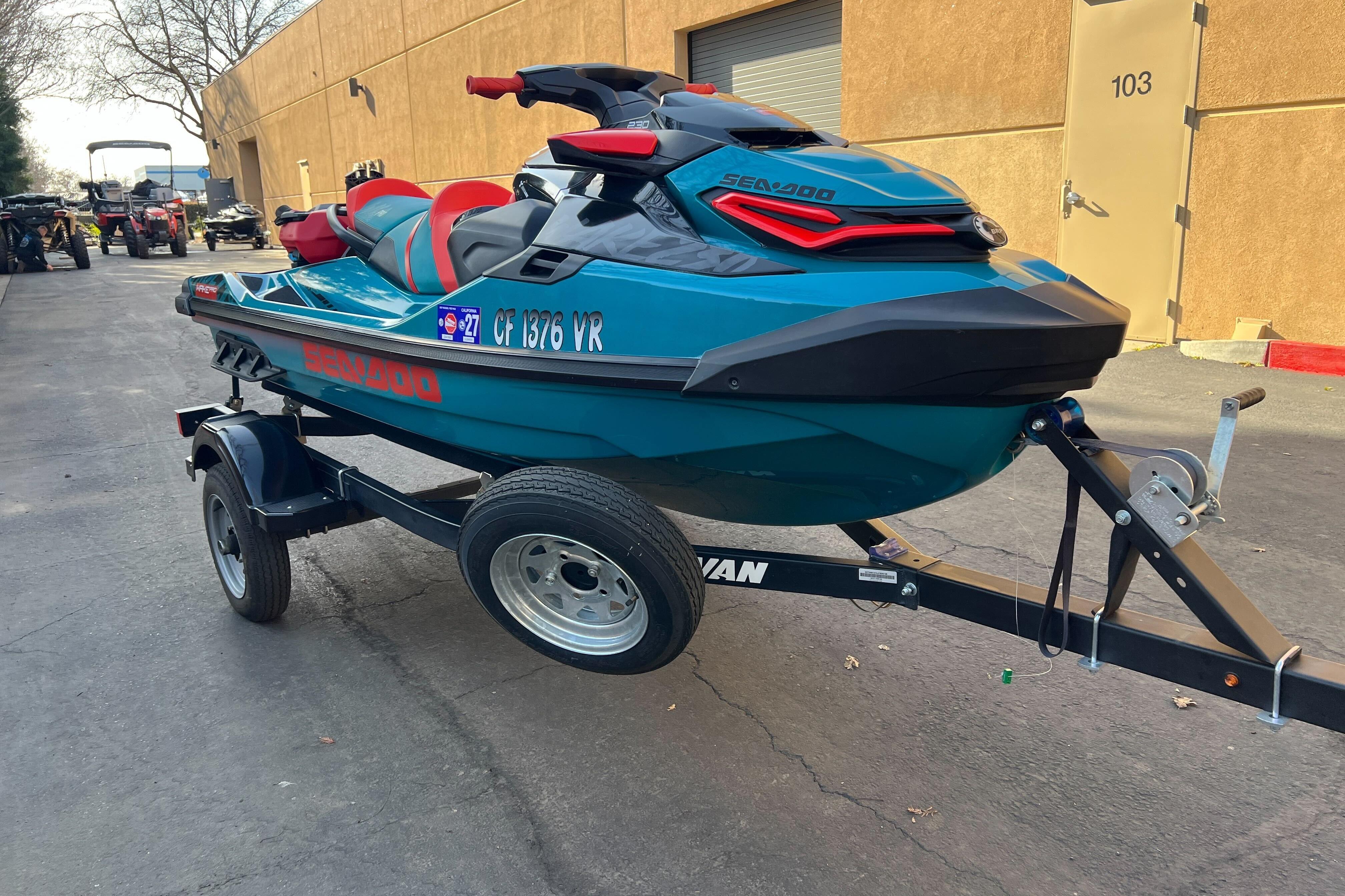2018 Sea-Doo Wake Pro 230 on trailer, parked outdoors near a building.