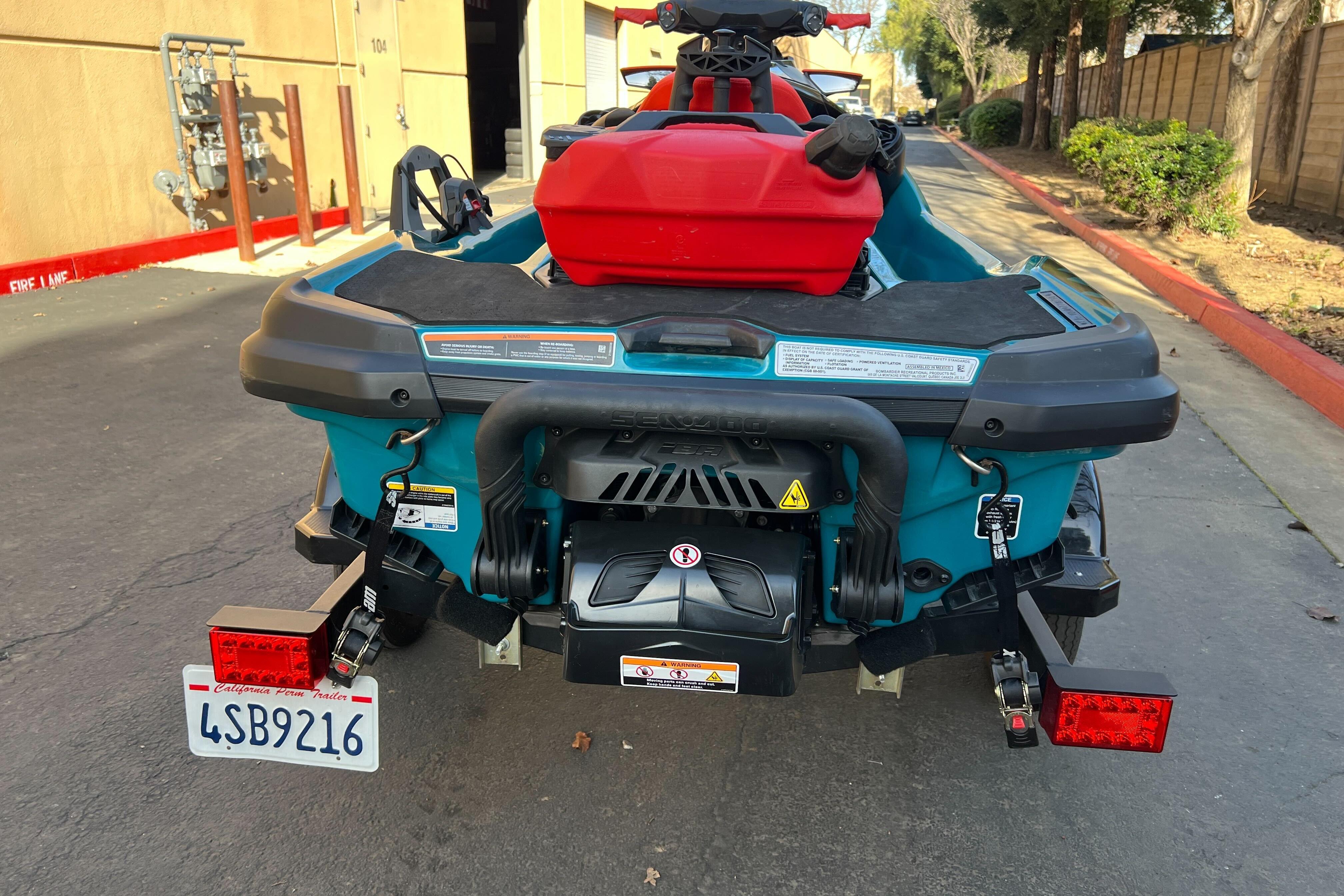 2018 Sea-Doo Wake Pro 230 on trailer, rear view, parked outdoors.