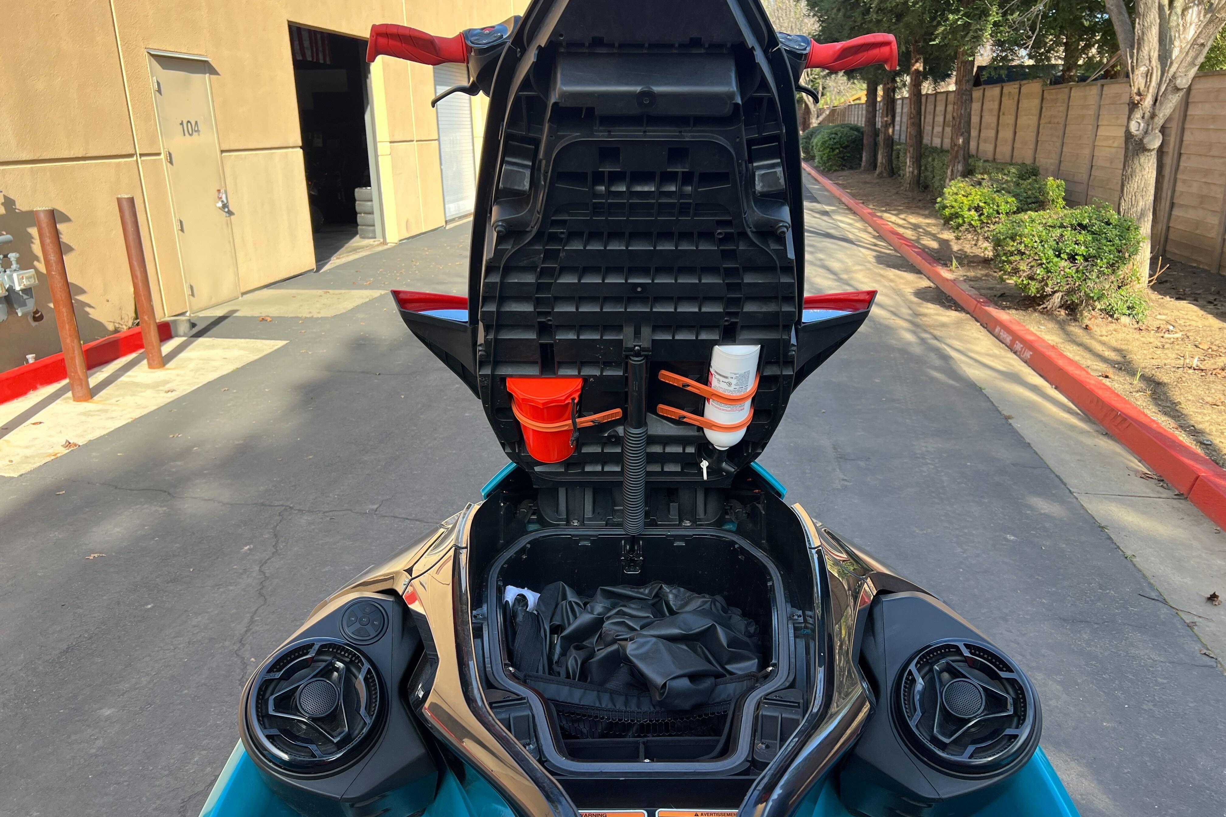 2018 Sea-Doo Wake Pro 230 with open storage compartment, showing interior details.