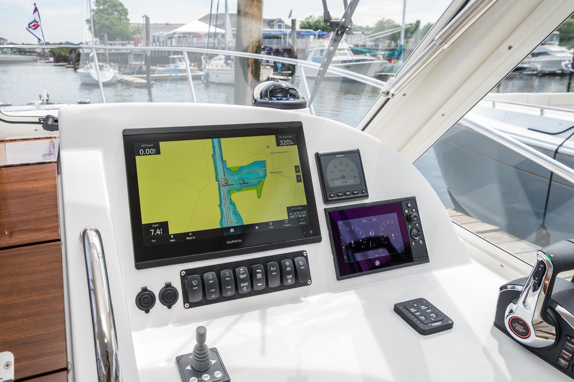 Helm of 2025 MJM 35 boat with advanced navigation displays and controls.