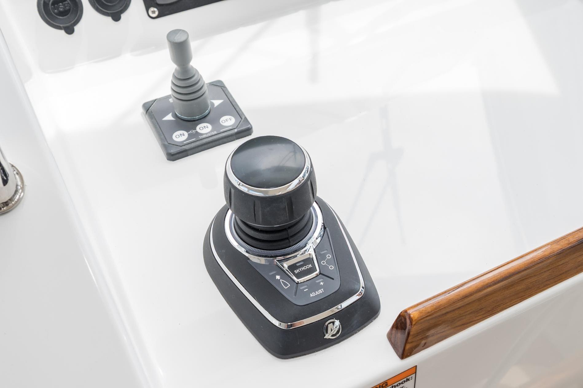 Control panel of 2025 MJM 35 boat with joystick and controls.