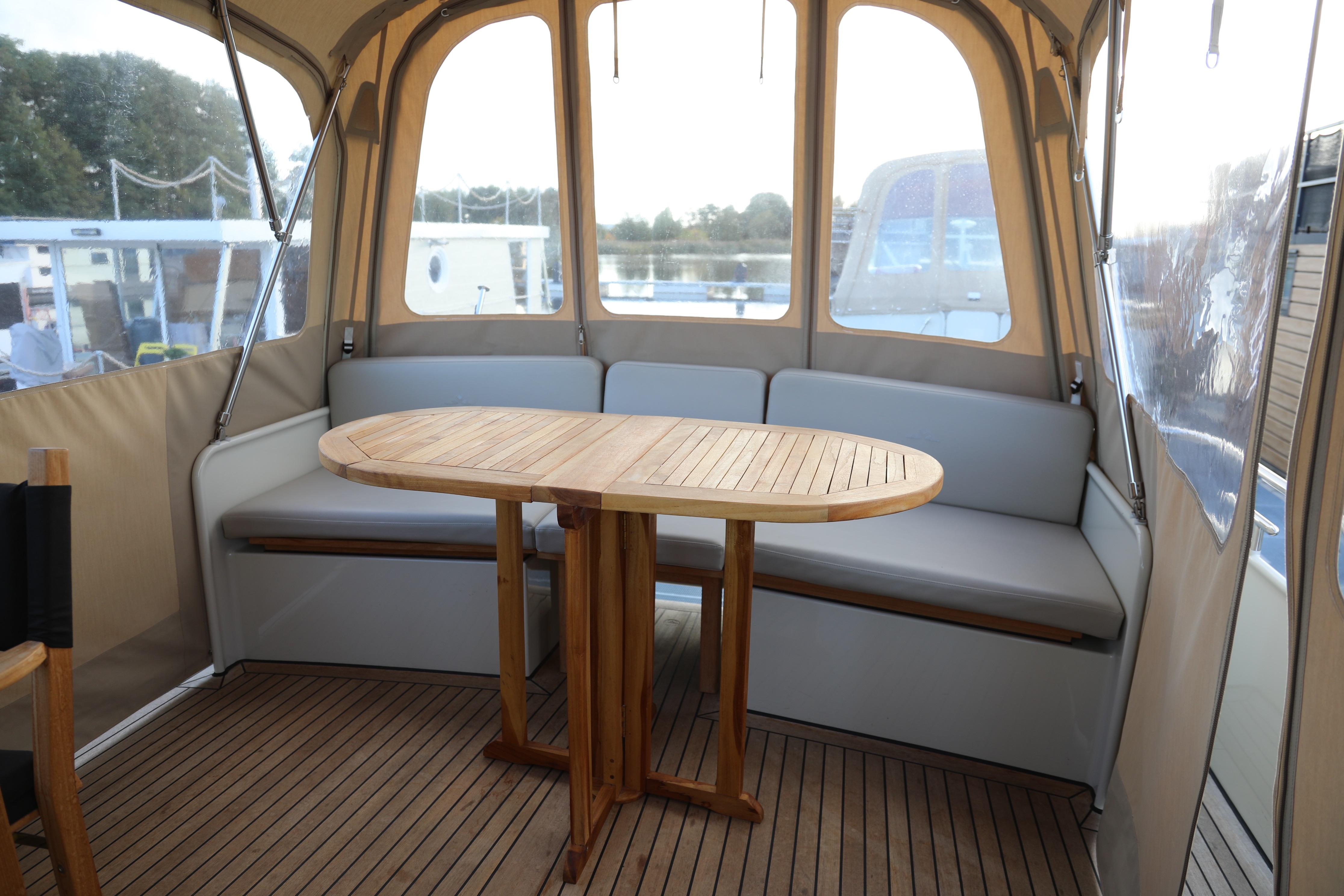 Linssen Grand Sturdy 35.0 AC INTERO 2022 yacht interior with wooden table and seating area.