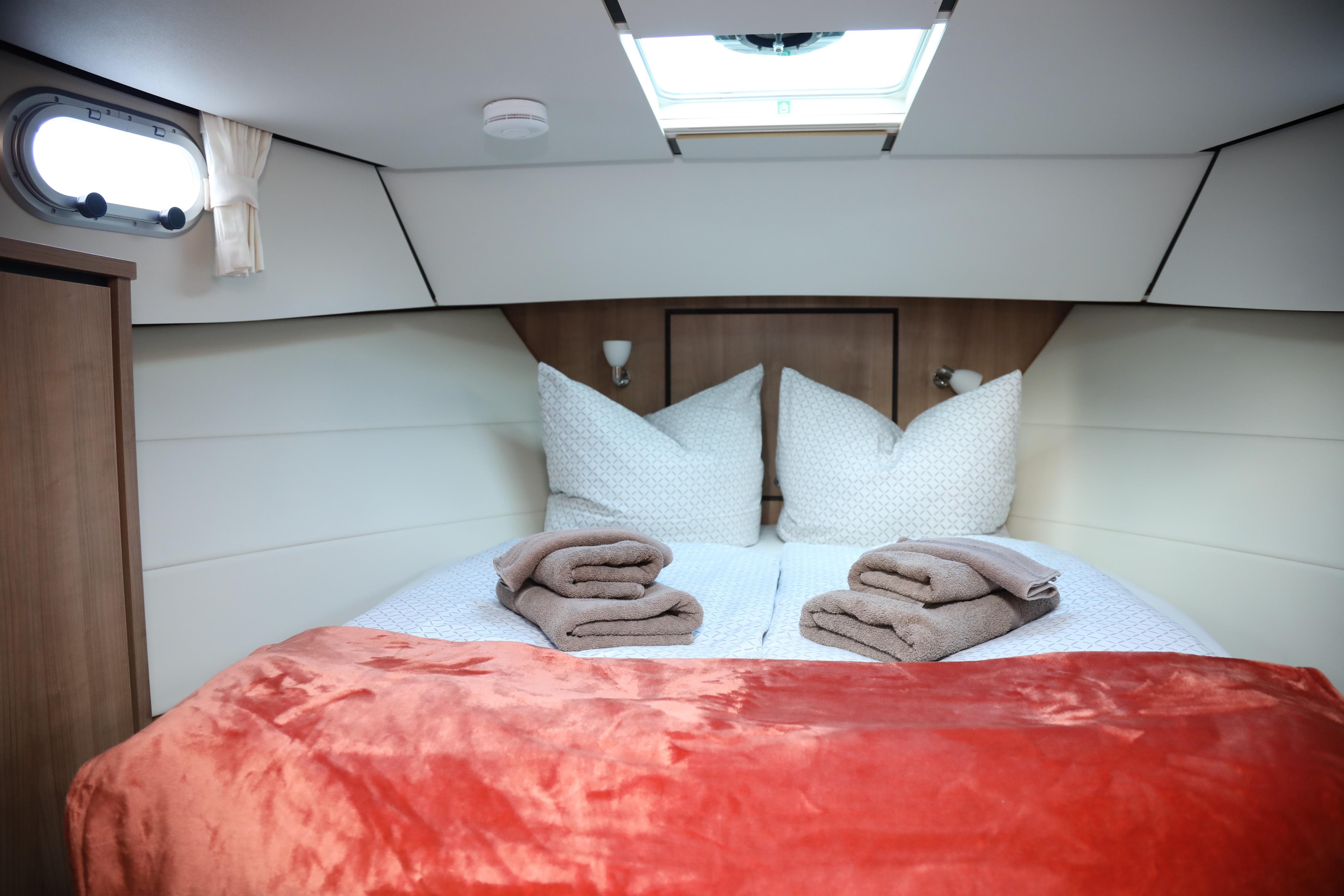 Cozy cabin interior of 2022 Linssen Grand Sturdy 35.0 AC INTERO with plush bedding.