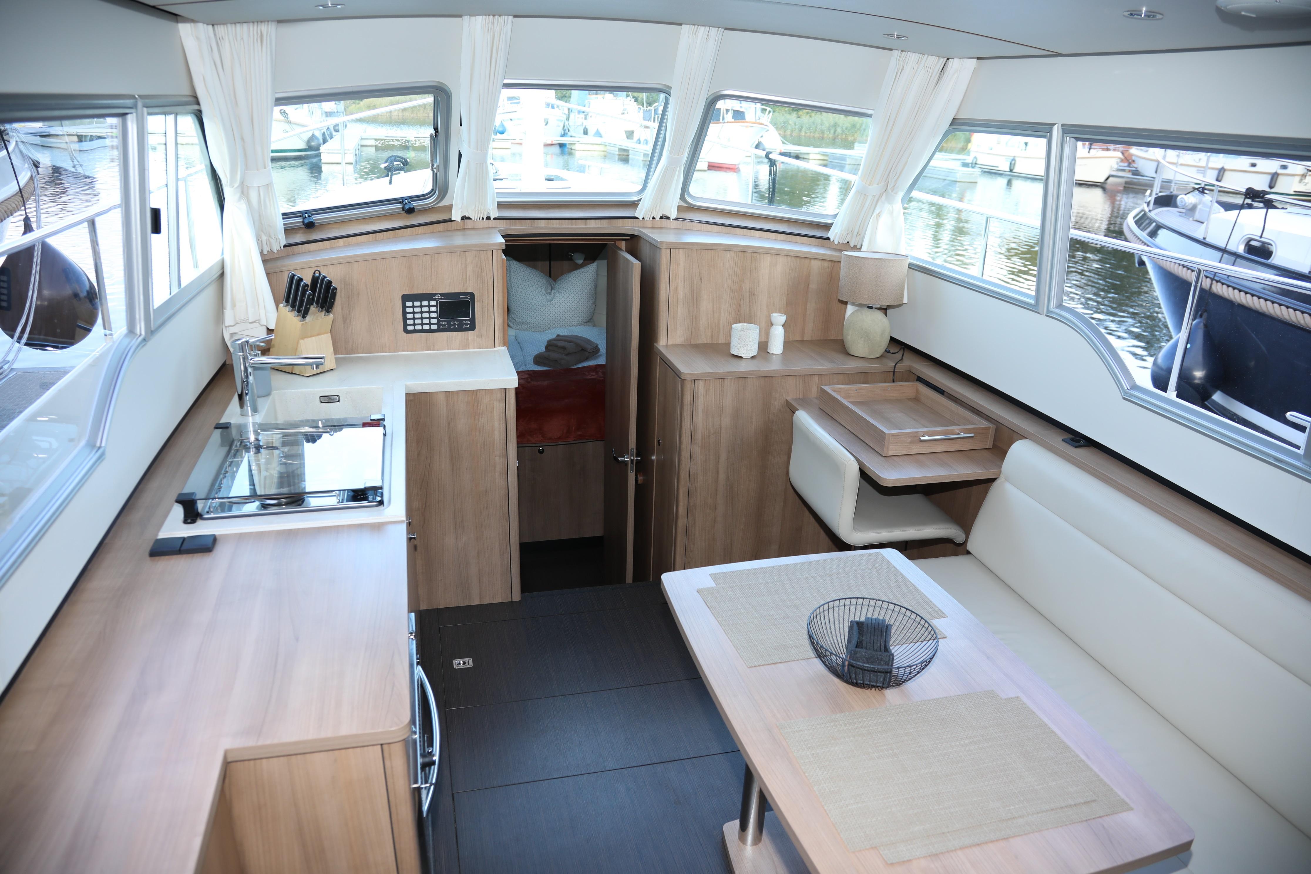 Interior of 2022 Linssen Grand Sturdy 35.0 AC INTERO yacht, featuring modern kitchen and dining area.
