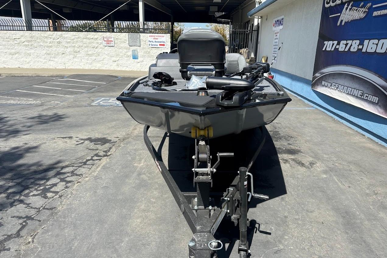2026 Tracker Bass Tracker Classic XL boat on trailer in parking lot.