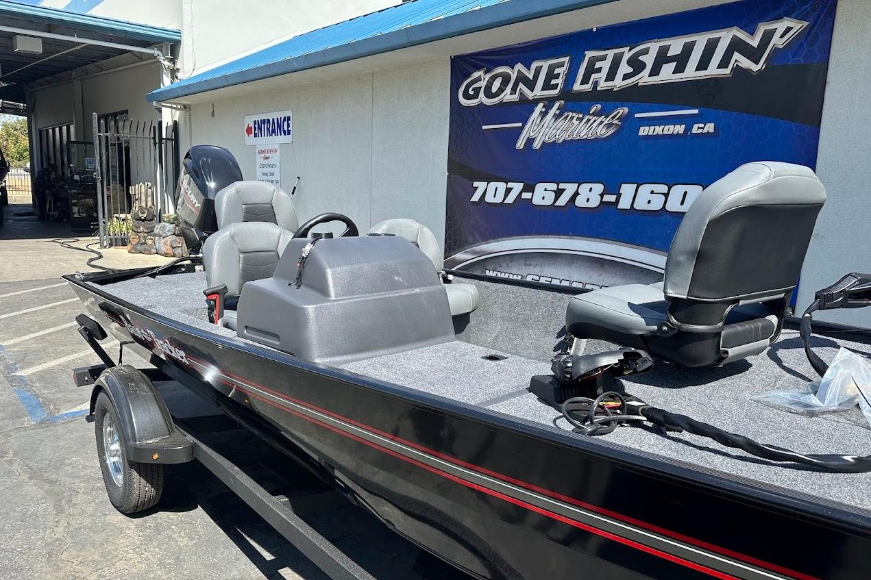 2026 Tracker Bass Tracker Classic XL boat at dealership, featuring comfortable seating and sleek design.
