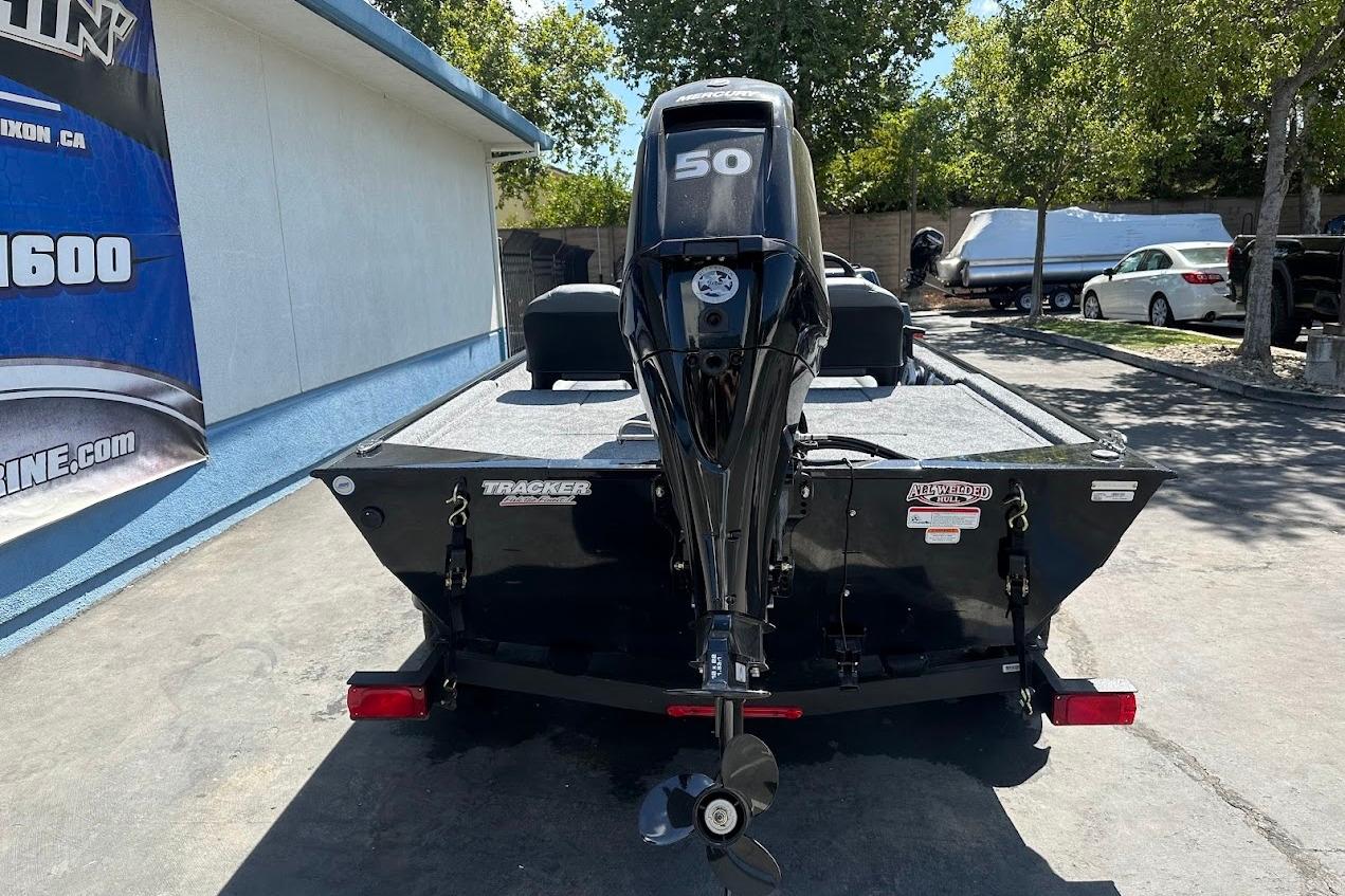 2026 Tracker Bass Tracker Classic XL boat with Mercury 50 engine, parked outdoors.
