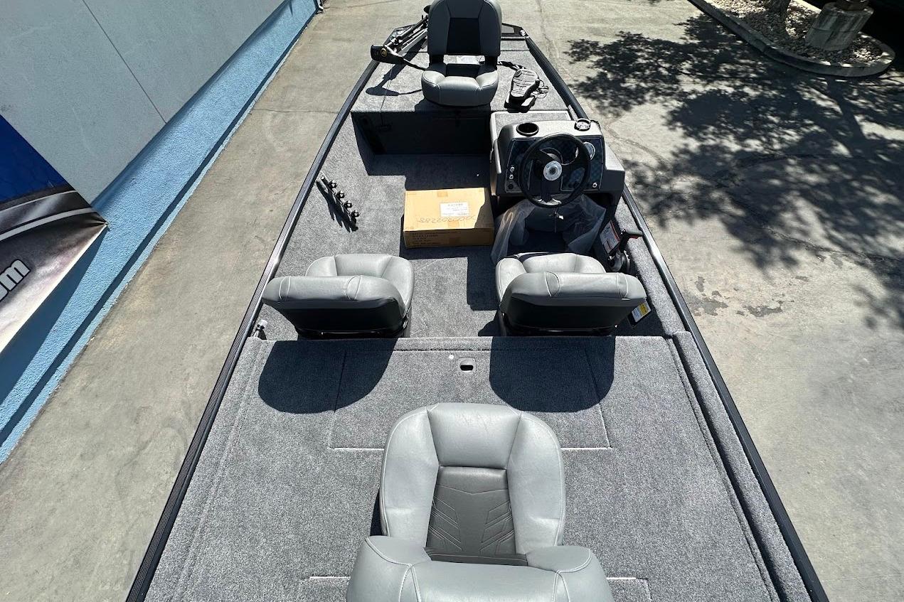2026 Tracker Bass Tracker Classic XL boat interior with gray seating and steering console.