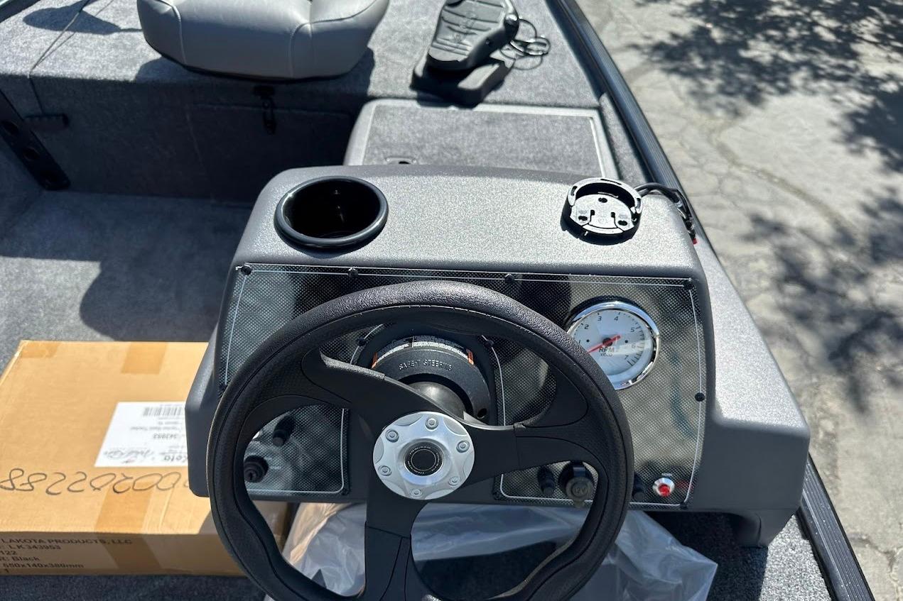 2026 Tracker Bass Tracker Classic XL dashboard with steering wheel and gauges.