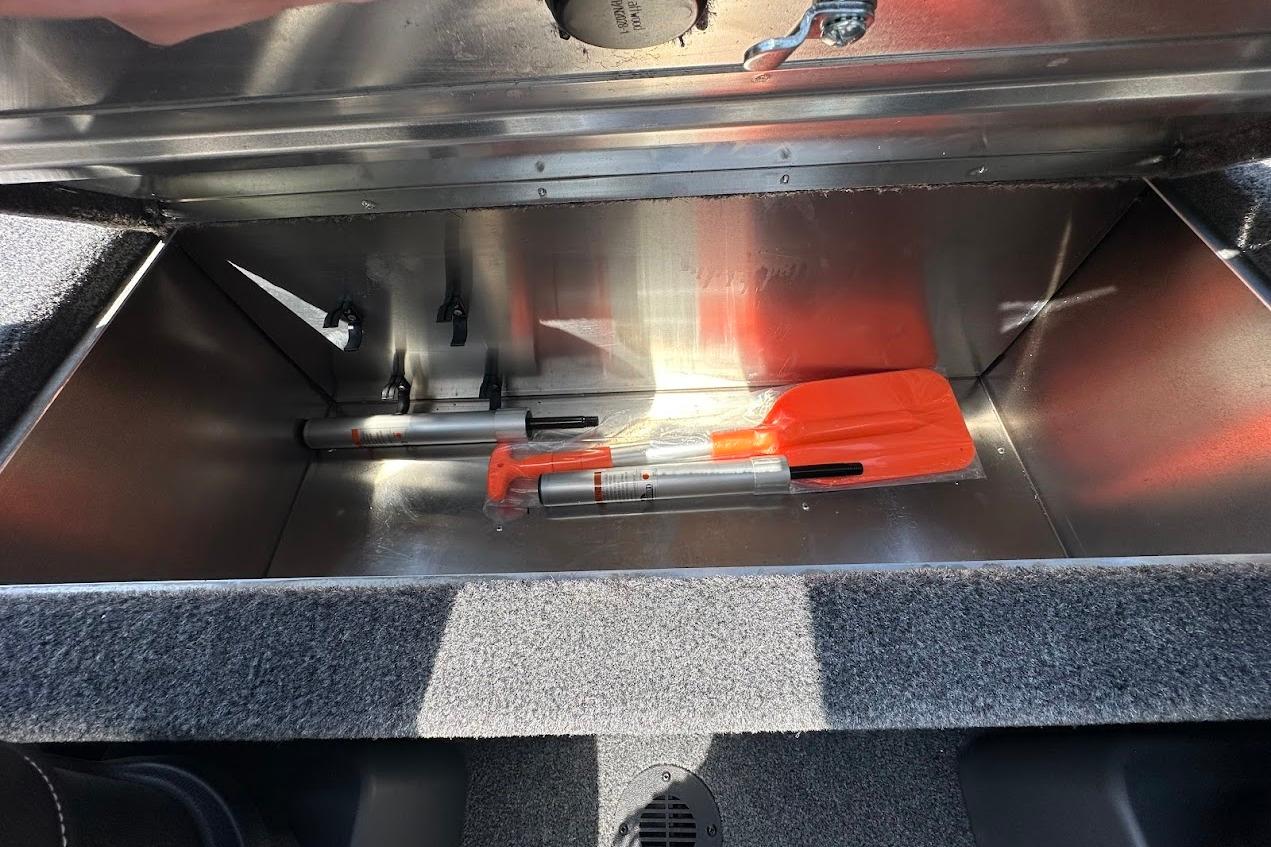 Storage compartment in 2026 Tracker Bass Tracker Classic XL with safety equipment.