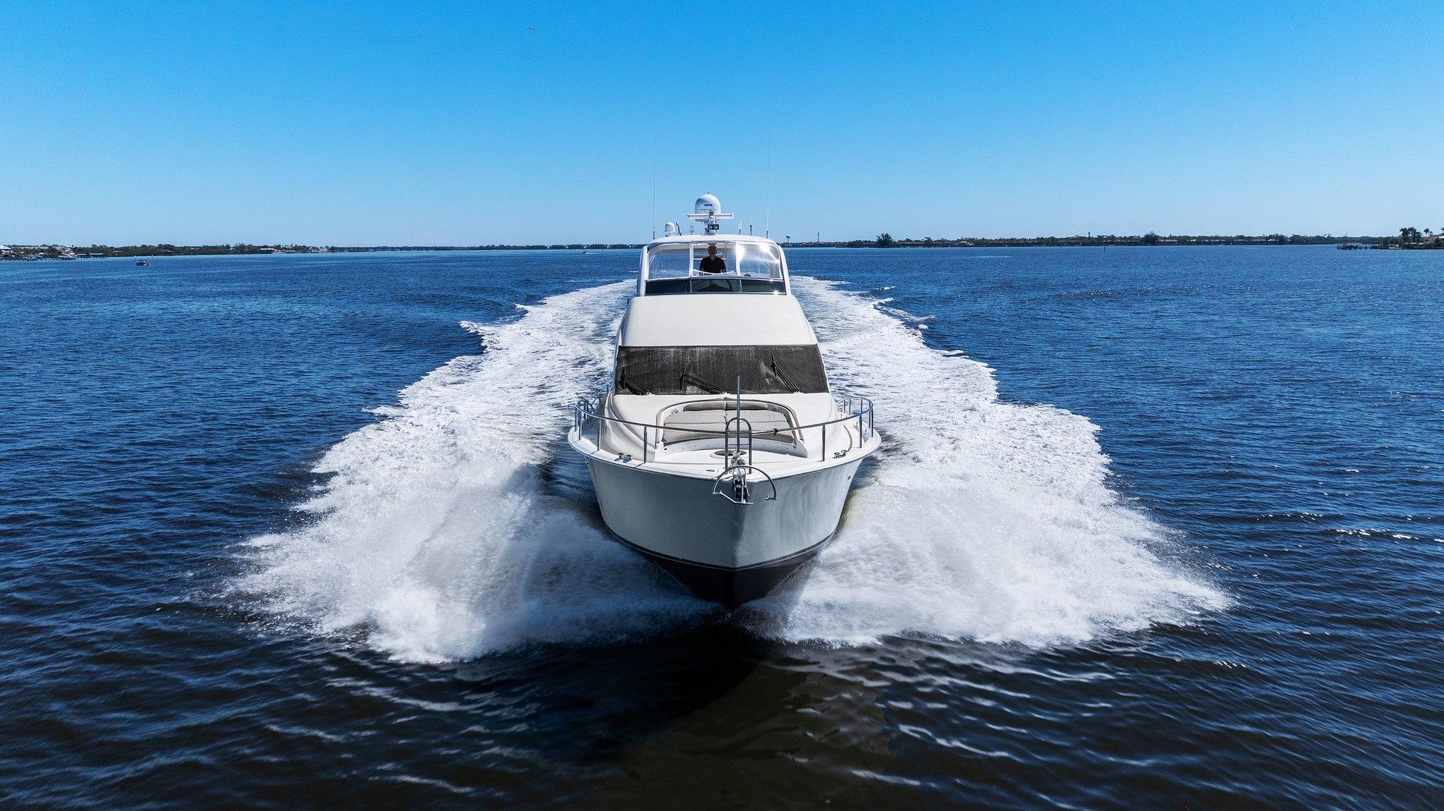 Lazzara-68 Pilothouse Motoryacht 2005 -FL-US-2005 Lazzara 68 Pilothouse Motoryacht cruising on open water, creating a wake.-9729104
