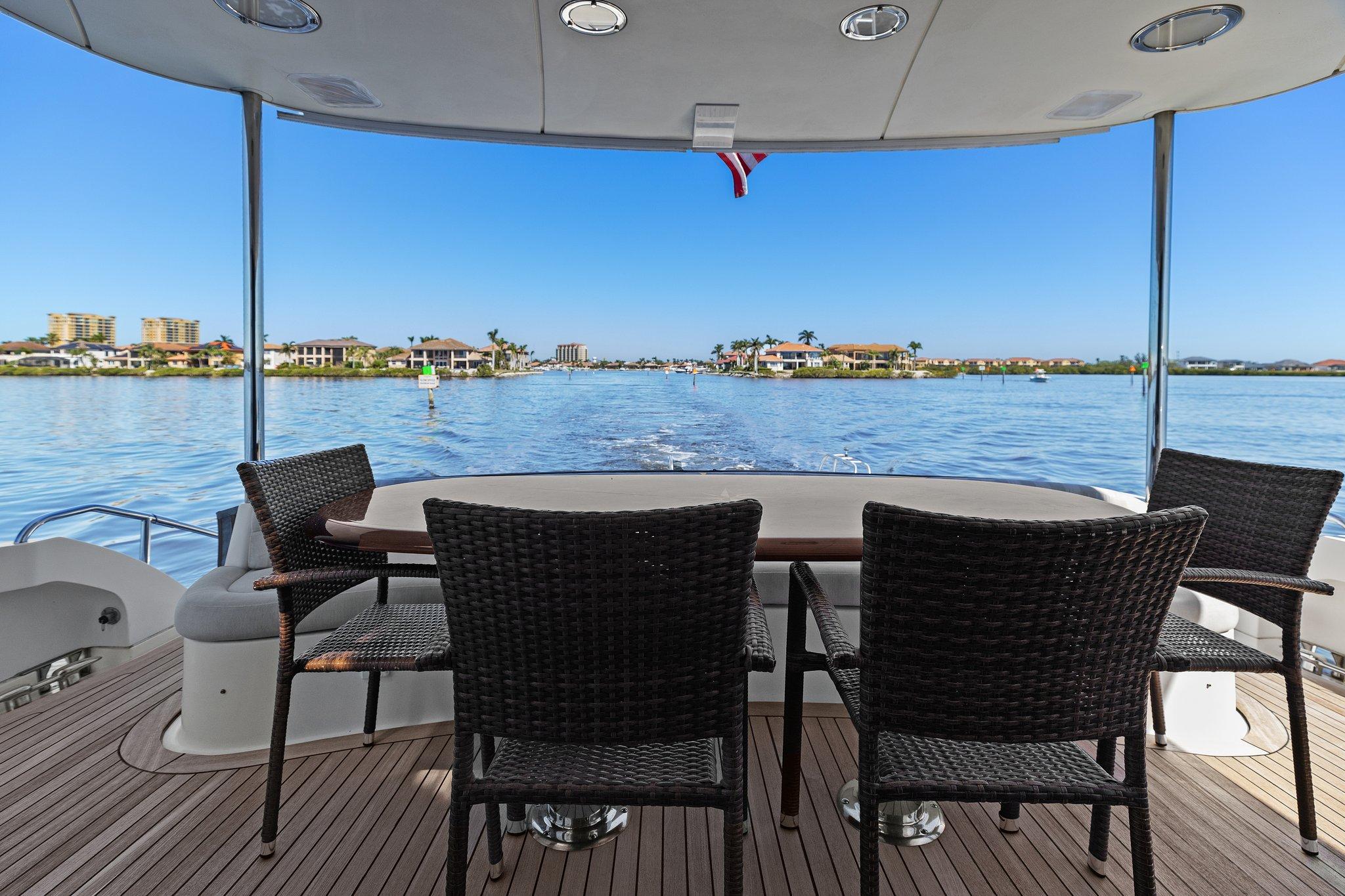 Lazzara-68 Pilothouse Motoryacht 2005 -FL-US-Outdoor seating on 2005 Lazzara 68 Pilothouse Motoryacht with scenic waterfront view.-9729104 | Thumbnail