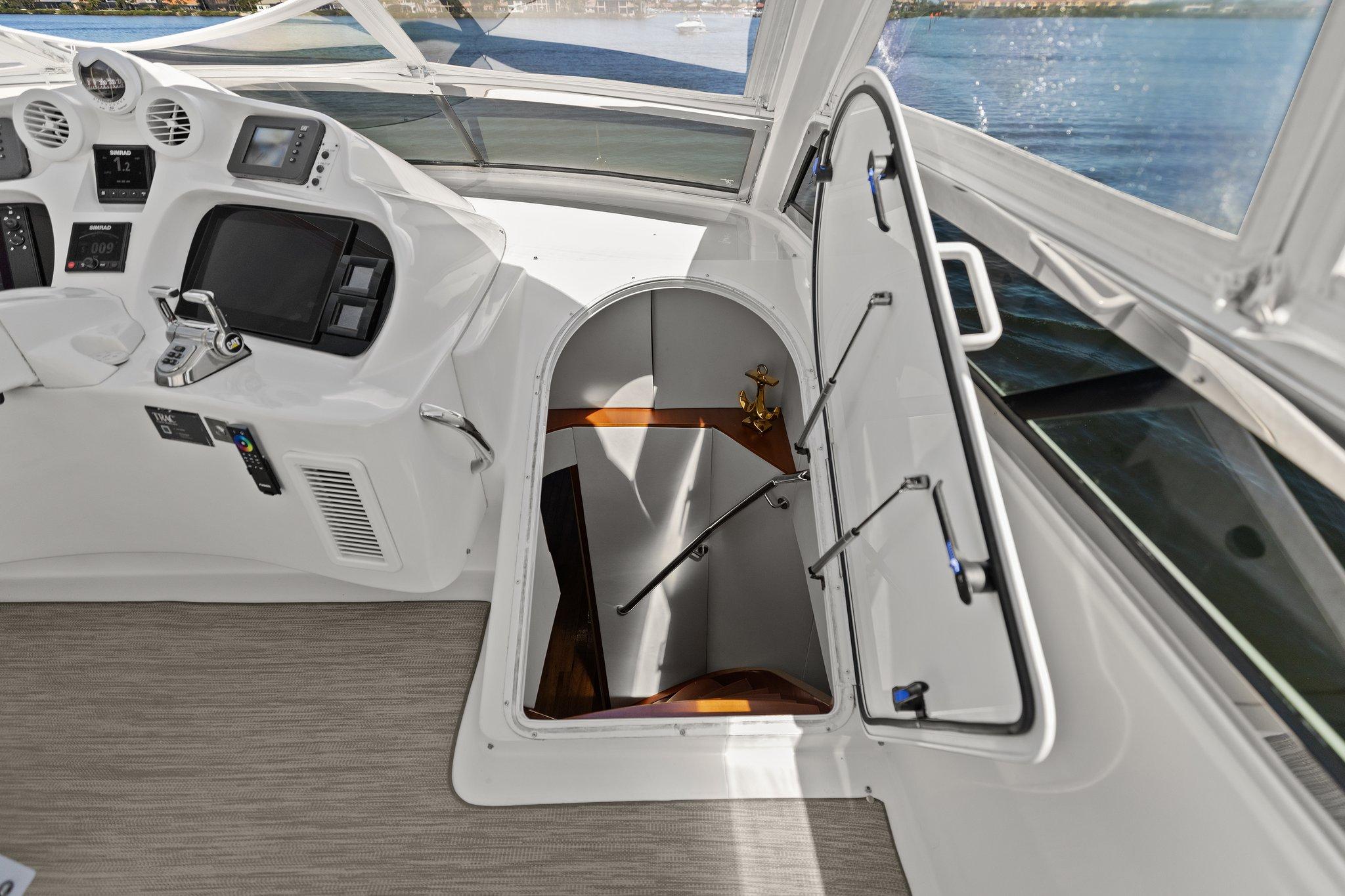 Lazzara-68 Pilothouse Motoryacht 2005 -FL-US-2005 Lazzara 68 Pilothouse Motoryacht helm with open hatch and control panel.-9729104 | Thumbnail