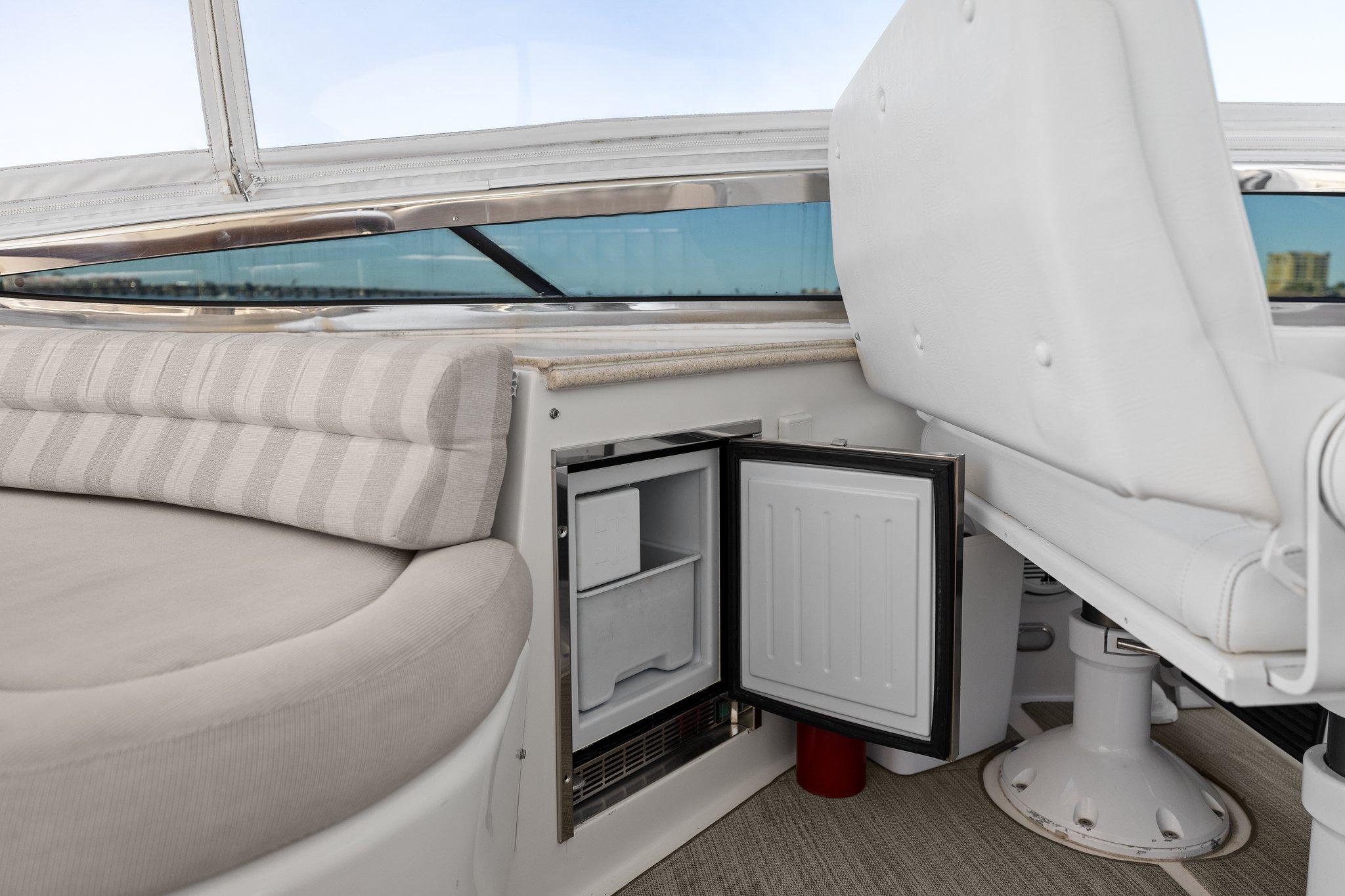 Lazzara-68 Pilothouse Motoryacht 2005 -FL-US-2005 Lazzara 68 Pilothouse Motoryacht interior with seating and open mini fridge.-9729104 | Thumbnail