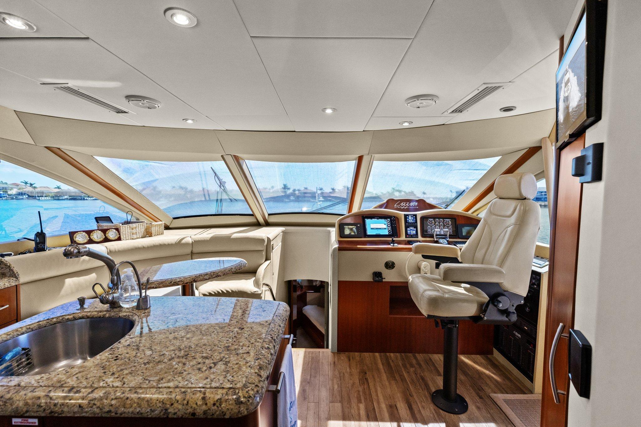 Lazzara-68 Pilothouse Motoryacht 2005 -FL-US-Luxurious interior of 2005 Lazzara 68 Pilothouse Motoryacht with helm and seating area.-9729104 | Thumbnail
