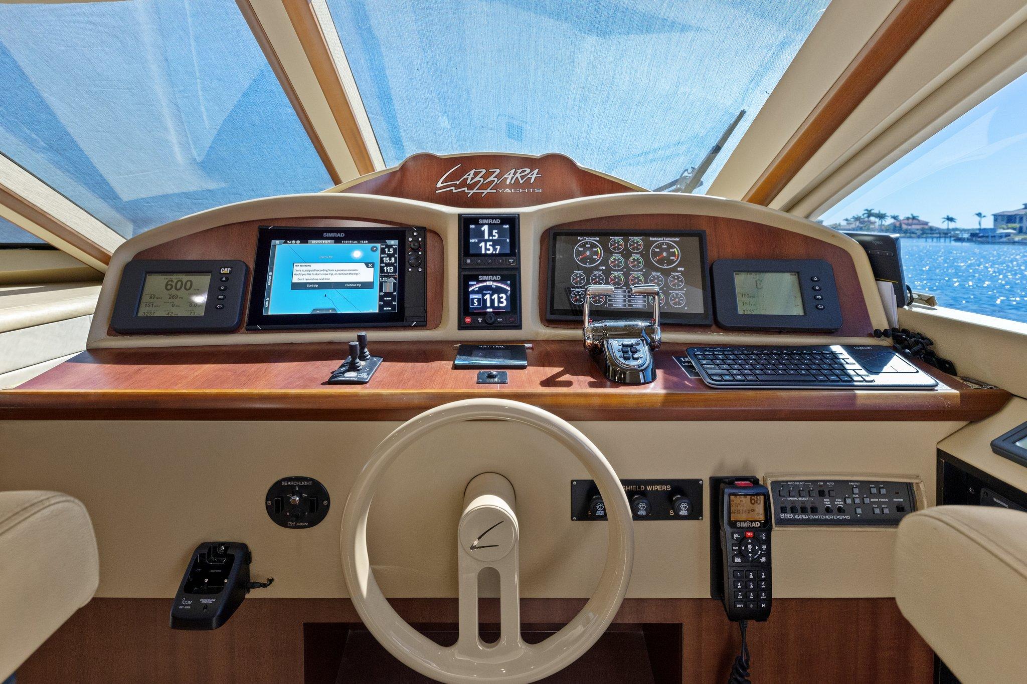 Lazzara-68 Pilothouse Motoryacht 2005 -FL-US-Pilothouse of 2005 Lazzara 68 Motoryacht with navigation instruments and steering wheel.-9729104 | Thumbnail