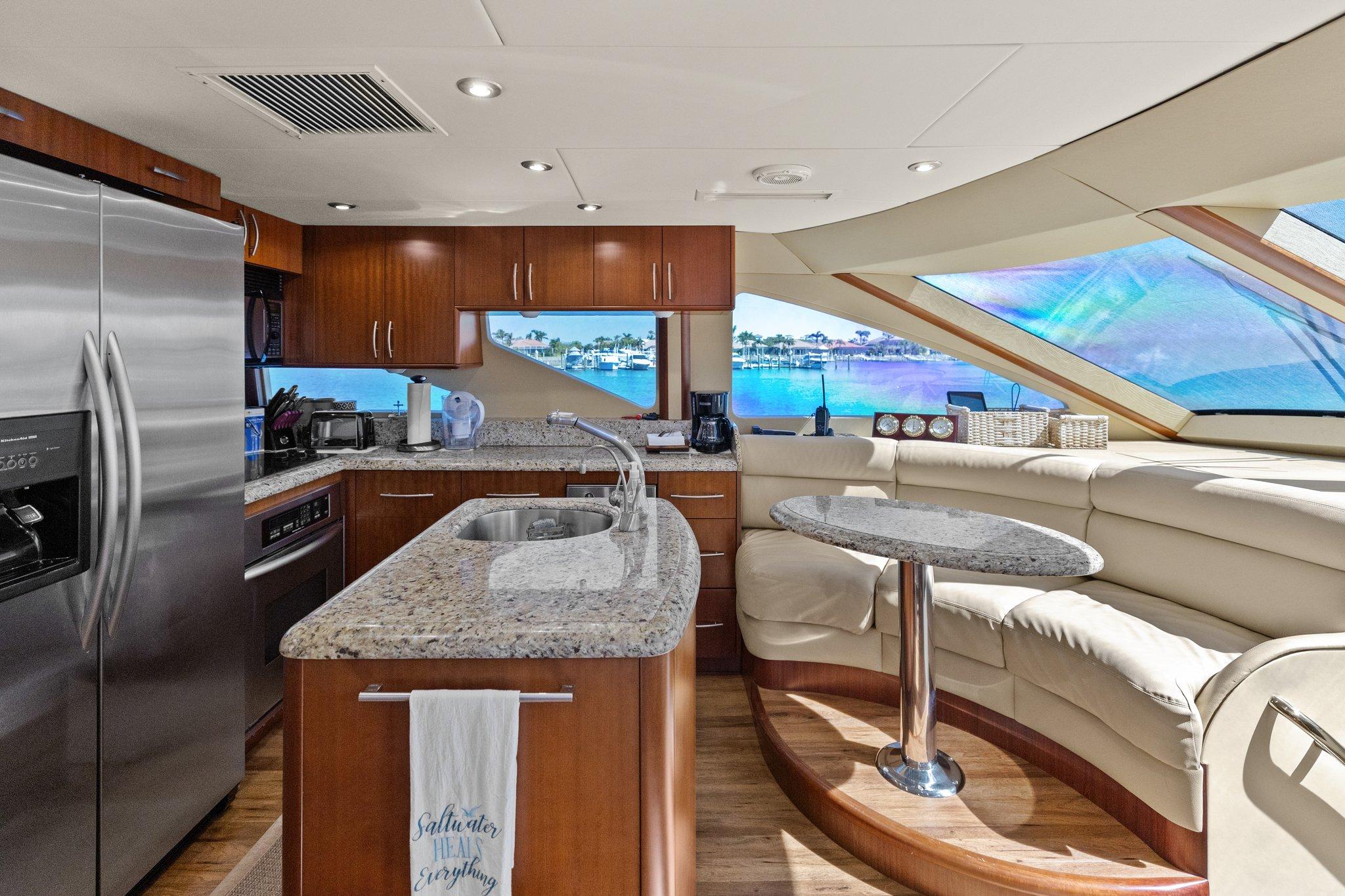 Lazzara-68 Pilothouse Motoryacht 2005 -FL-US-Luxurious kitchen and seating area inside a 2005 Lazzara 68 Pilothouse Motoryacht.-9729104 | Thumbnail