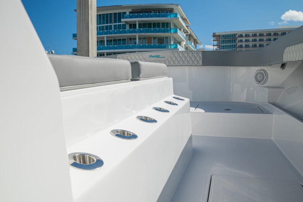 Front Runner-37 Catamaran 2026 -FL-US-2026 Front Runner 37 Catamaran interior with modern seating and rod holders, against urban backdrop.-9829170 | Thumbnail