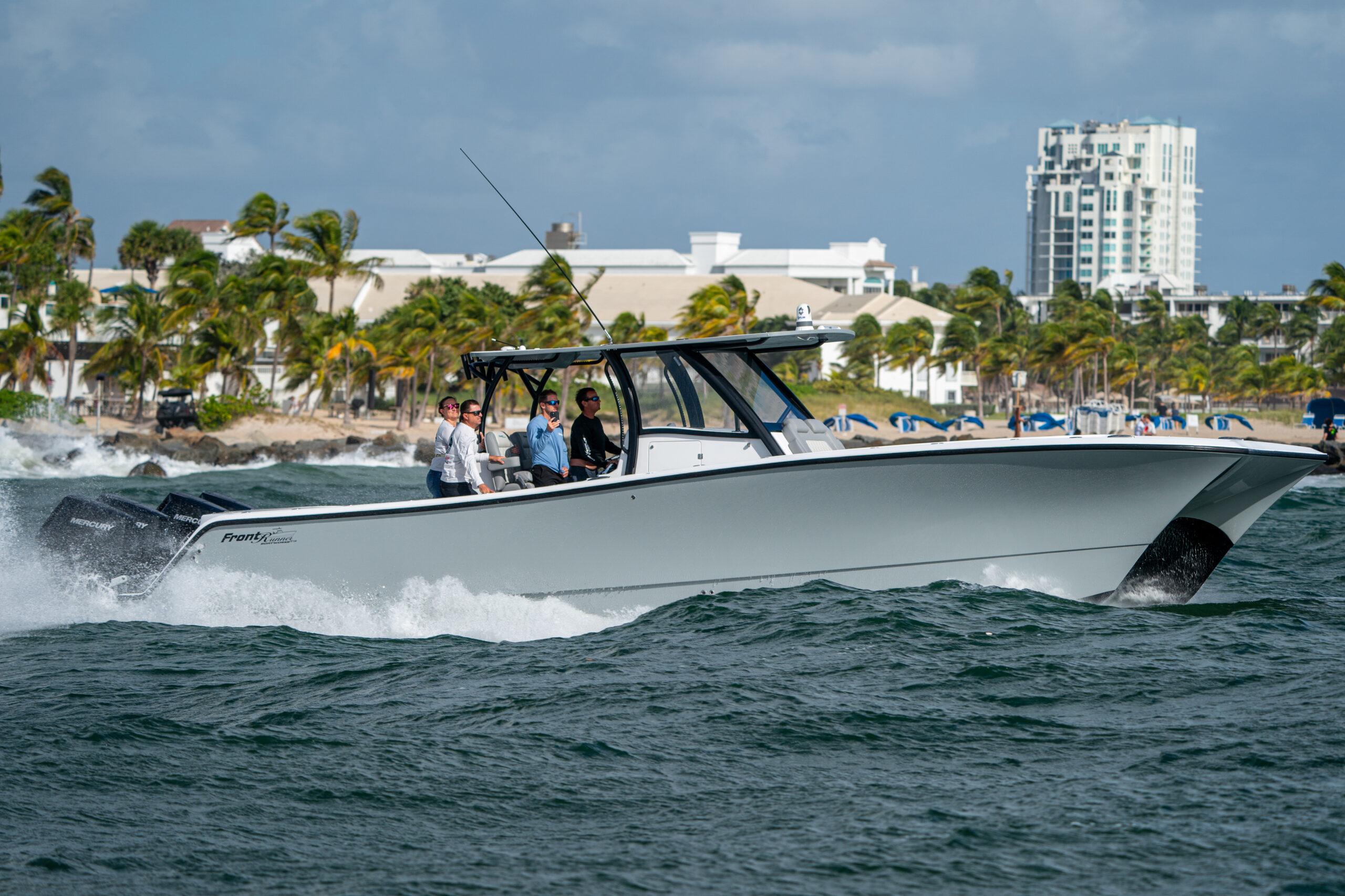 Front Runner-37 Catamaran 2026 -FL-US-2026 Front Runner 37 Catamaran cruising on ocean near coastal cityscape.-9829170