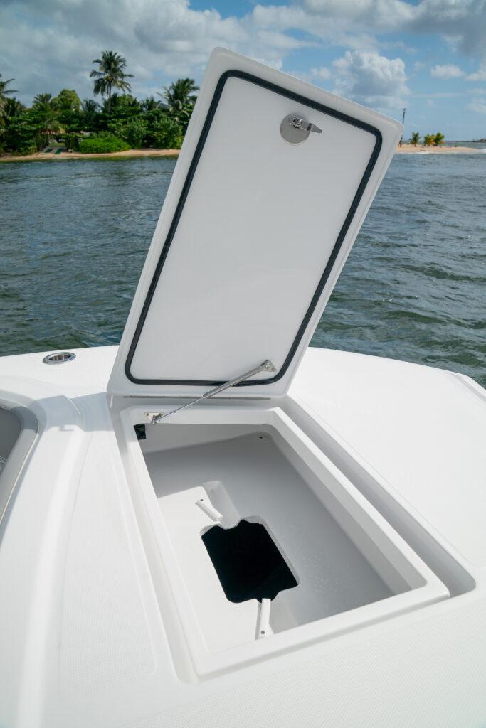 Front Runner-37 Catamaran 2026 -FL-US-2026 Front Runner 37 Catamaran storage compartment open on deck, near scenic shoreline.-9829170 | Thumbnail