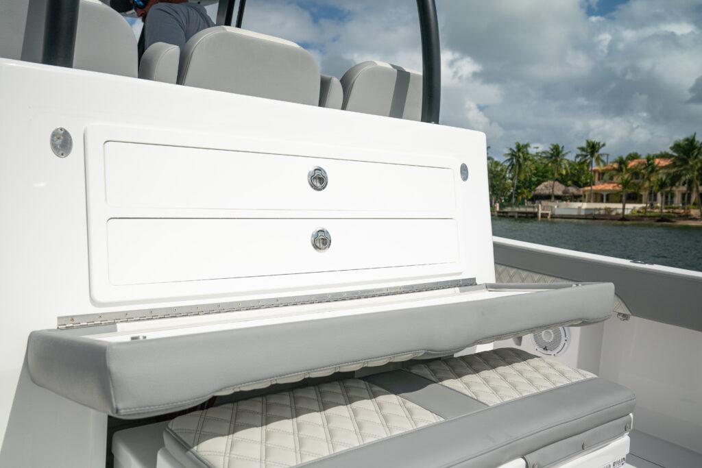 Front Runner-37 Catamaran 2026 -FL-US-2026 Front Runner 37 Catamaran interior seating and storage, featuring sleek design and coastal backdrop.-9829170 | Thumbnail