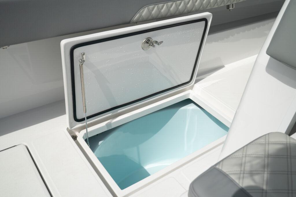 Front Runner-37 Catamaran 2026 -FL-US-2026 Front Runner 37 Catamaran storage compartment with open hatch and cushioned seating.-9829170 | Thumbnail