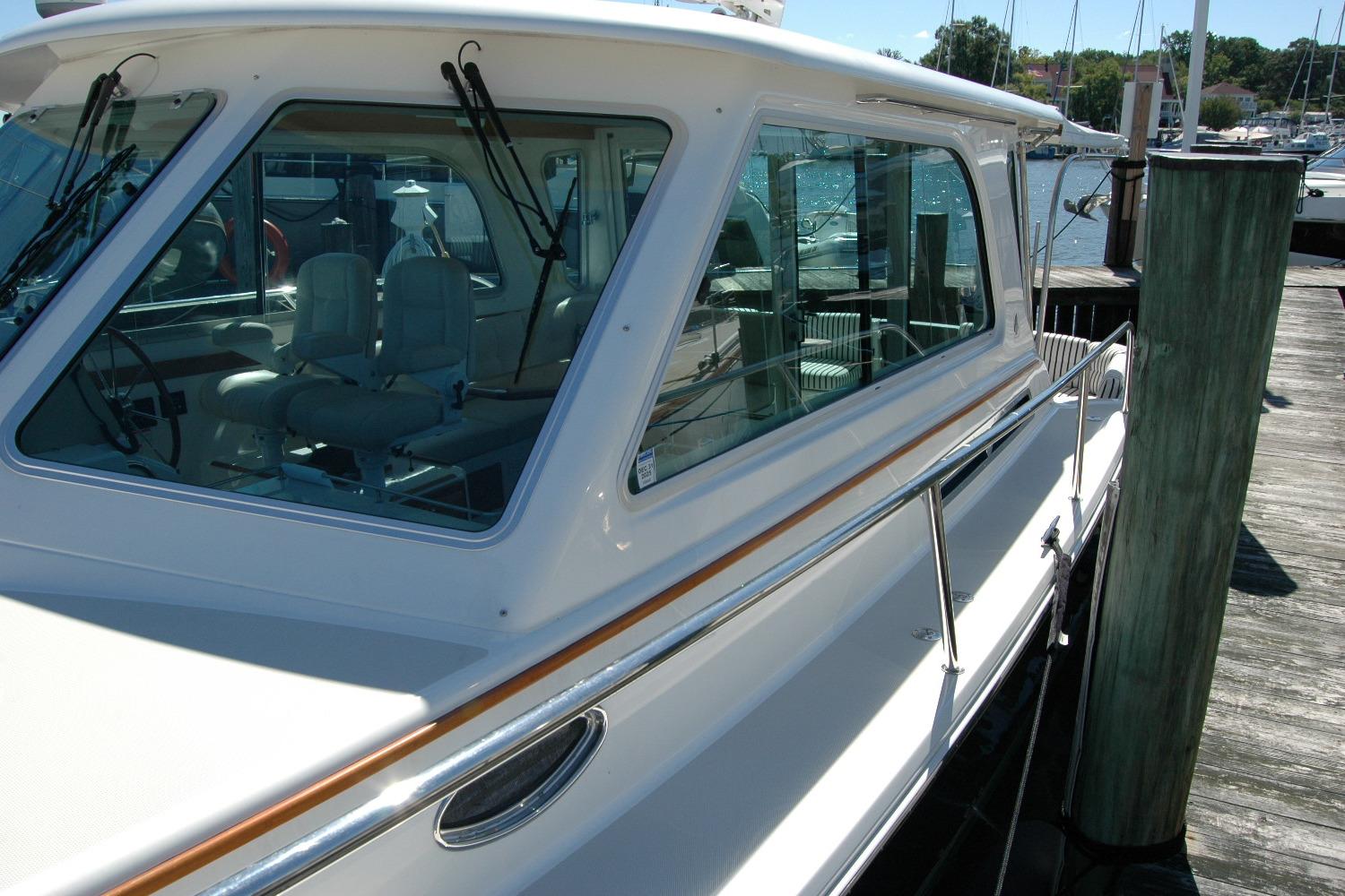 2014 Back Cove 37 yacht docked, showcasing sleek design and spacious interior.