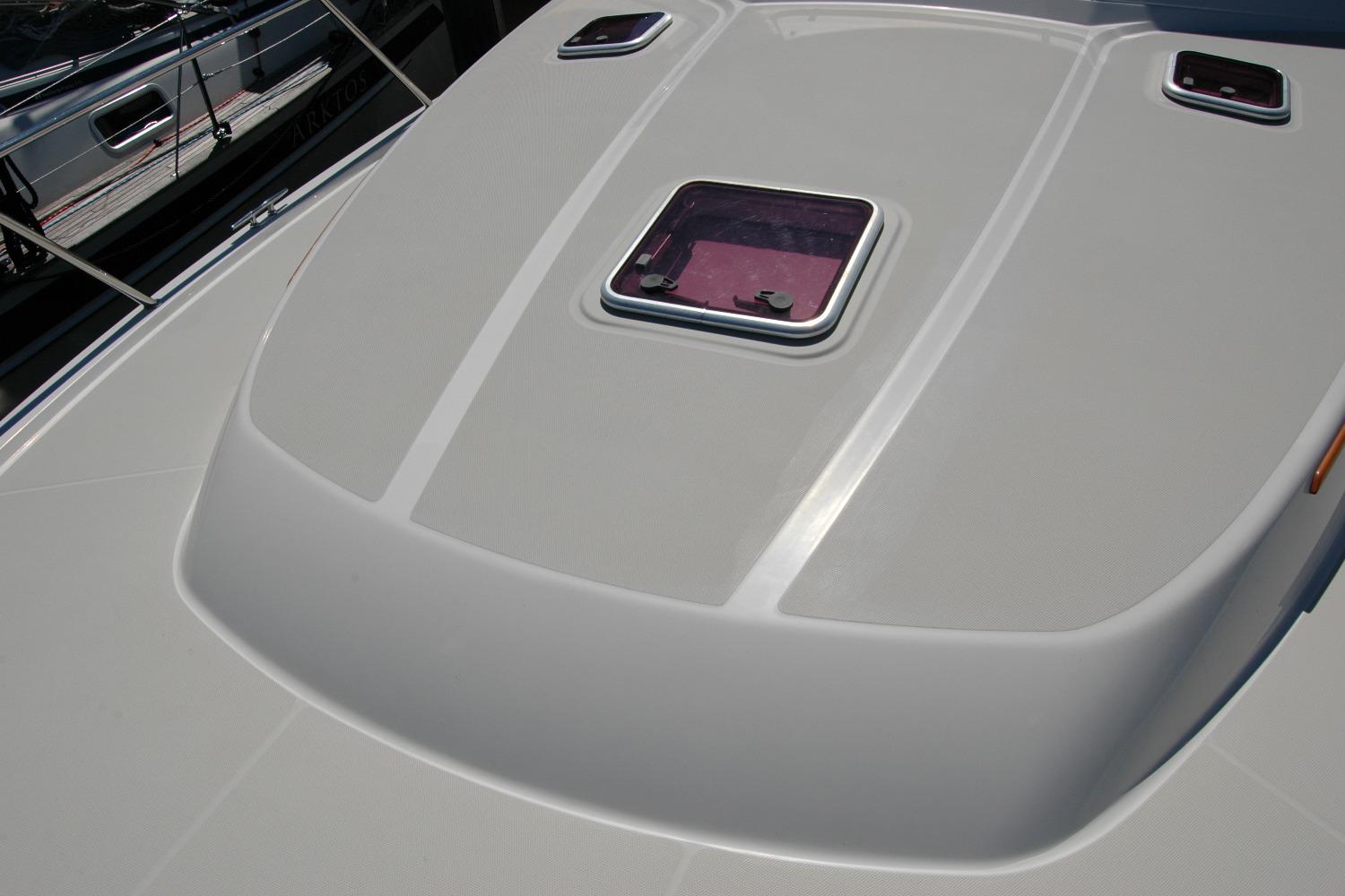 2014 Back Cove 37 yacht deck with hatch and sleek design.